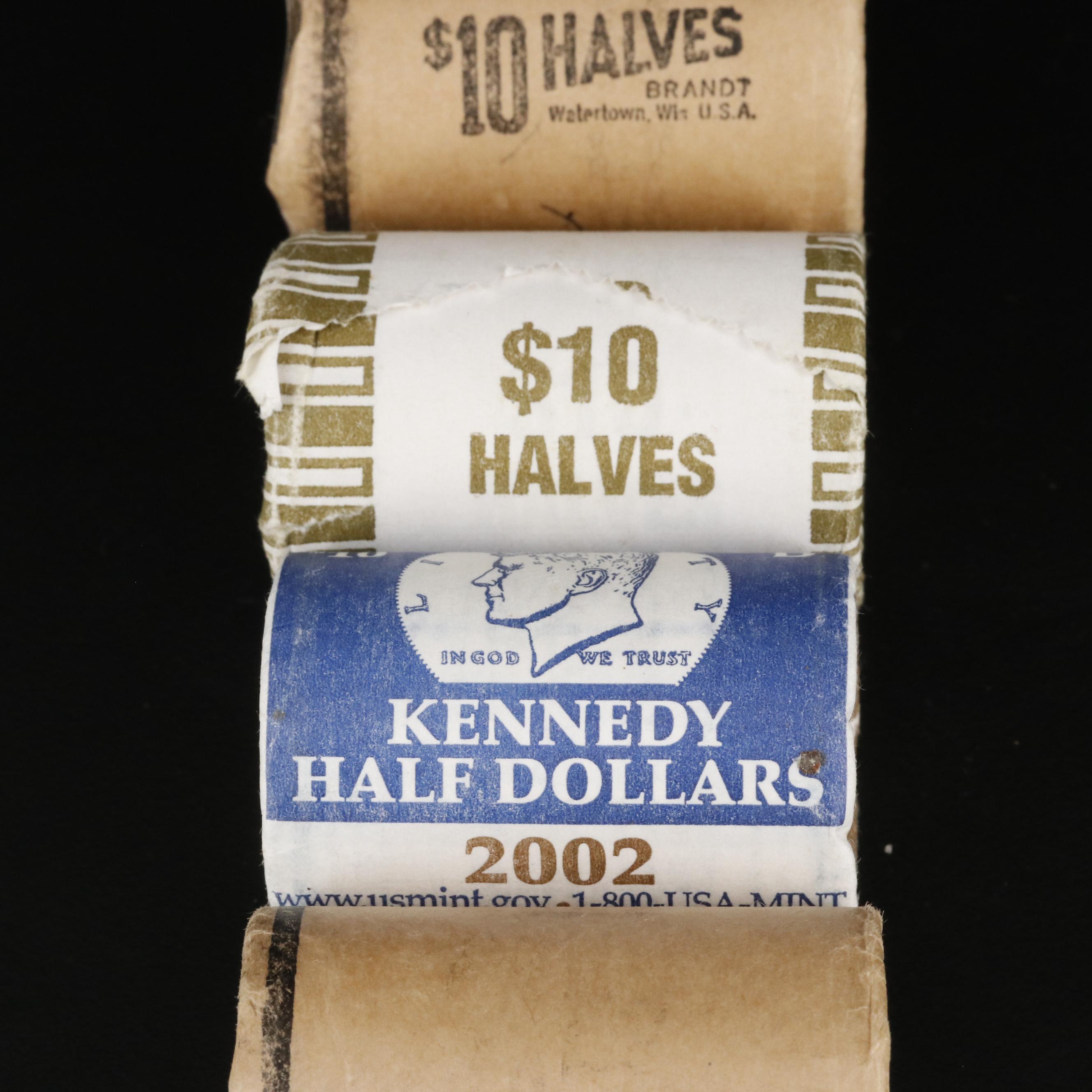 Four Uncirculated Rolls of Kennedy Half Dollars