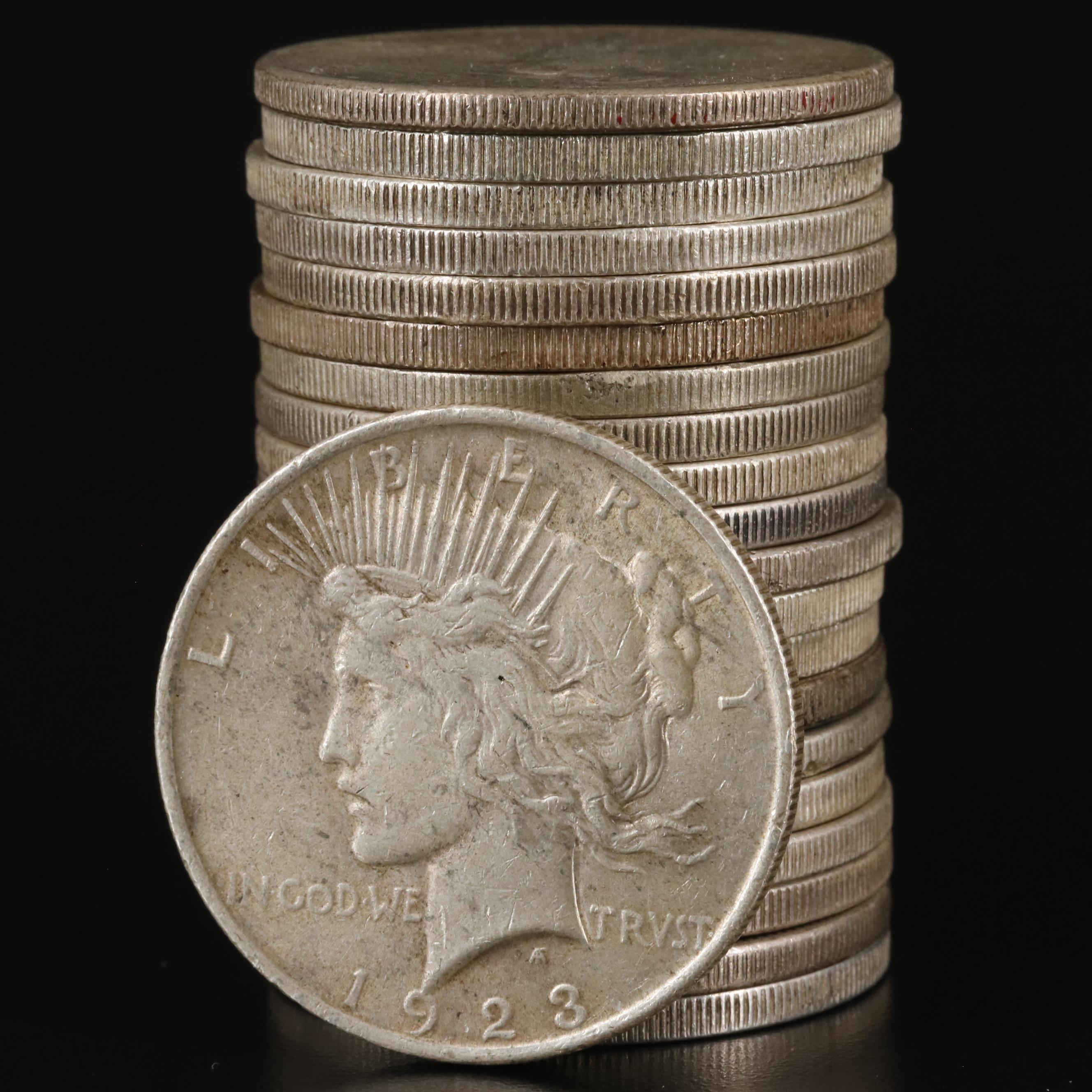 Roll of 21 Morgan and Peace Silver Dollars