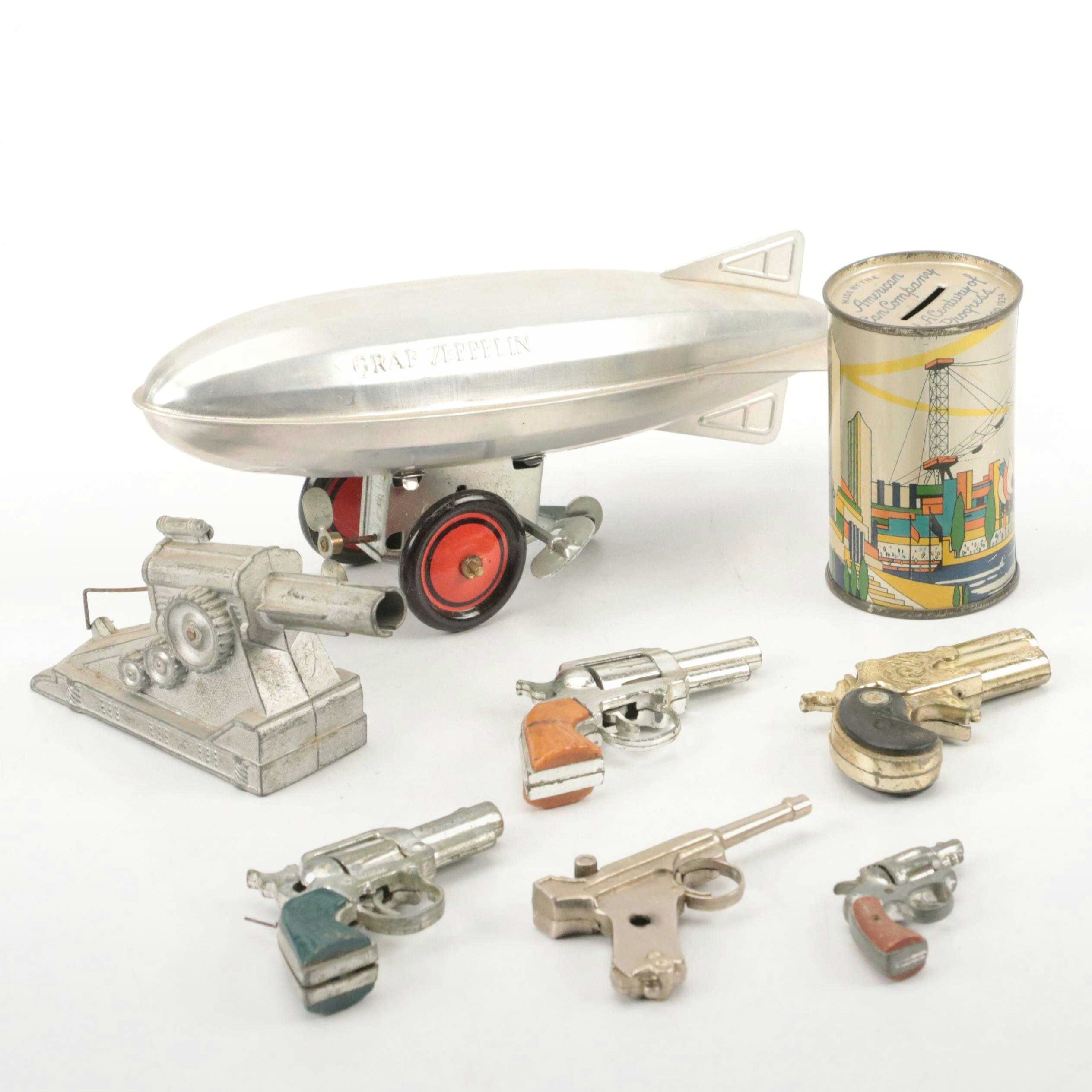 Schylling Tin Wind-Up Blimp Toy with Tin Litho Can Bank and Toy Weapons