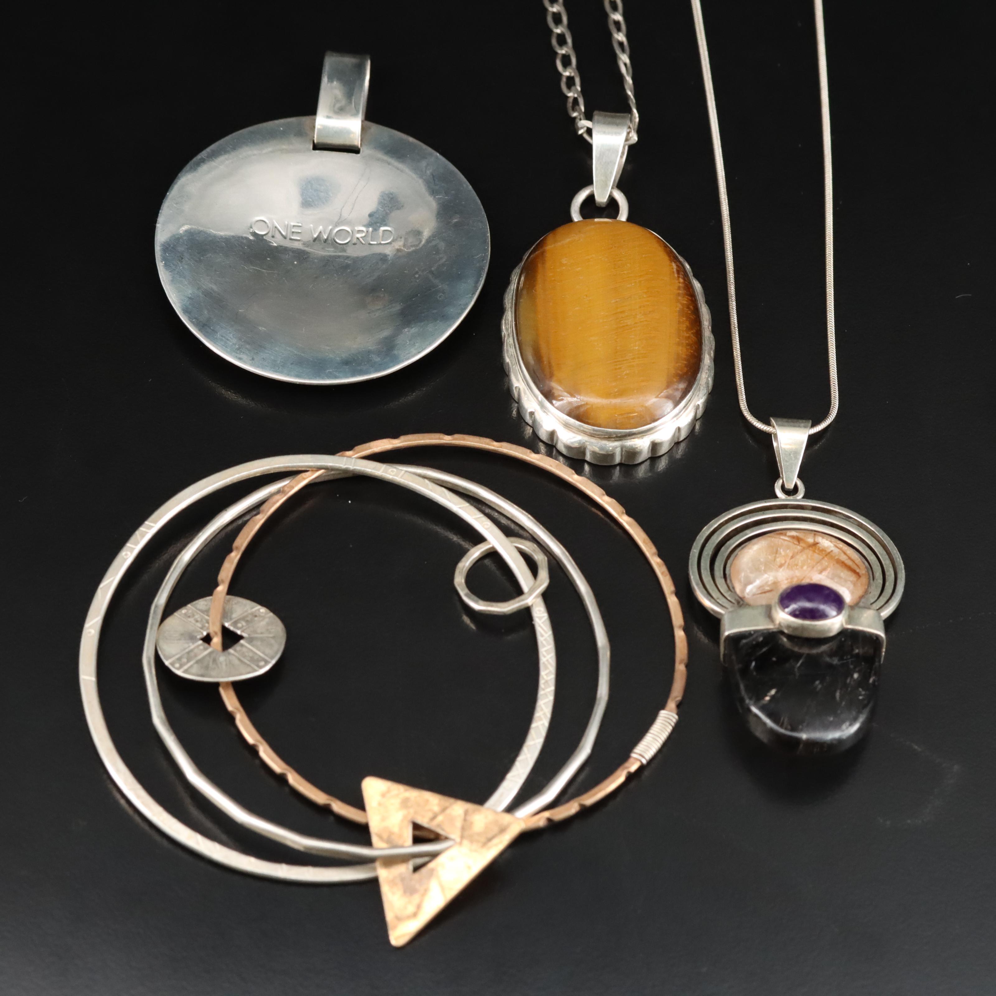 Robert Lee Morris Studio Disc Pendant and Artisan Featured in Sterling Jewelry