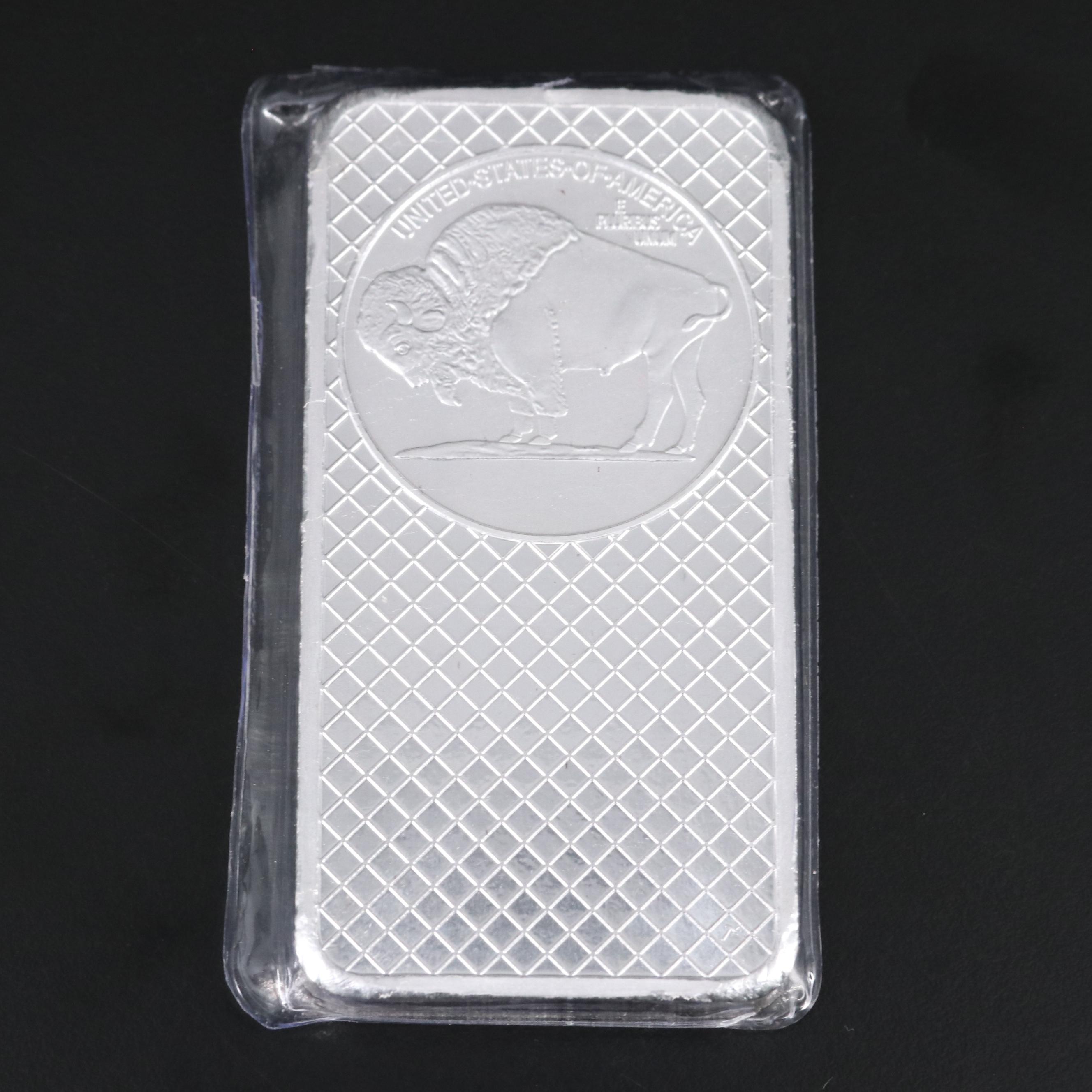 A Ten Troy Ounce and Four One Troy Ounce .999 Silver Bars