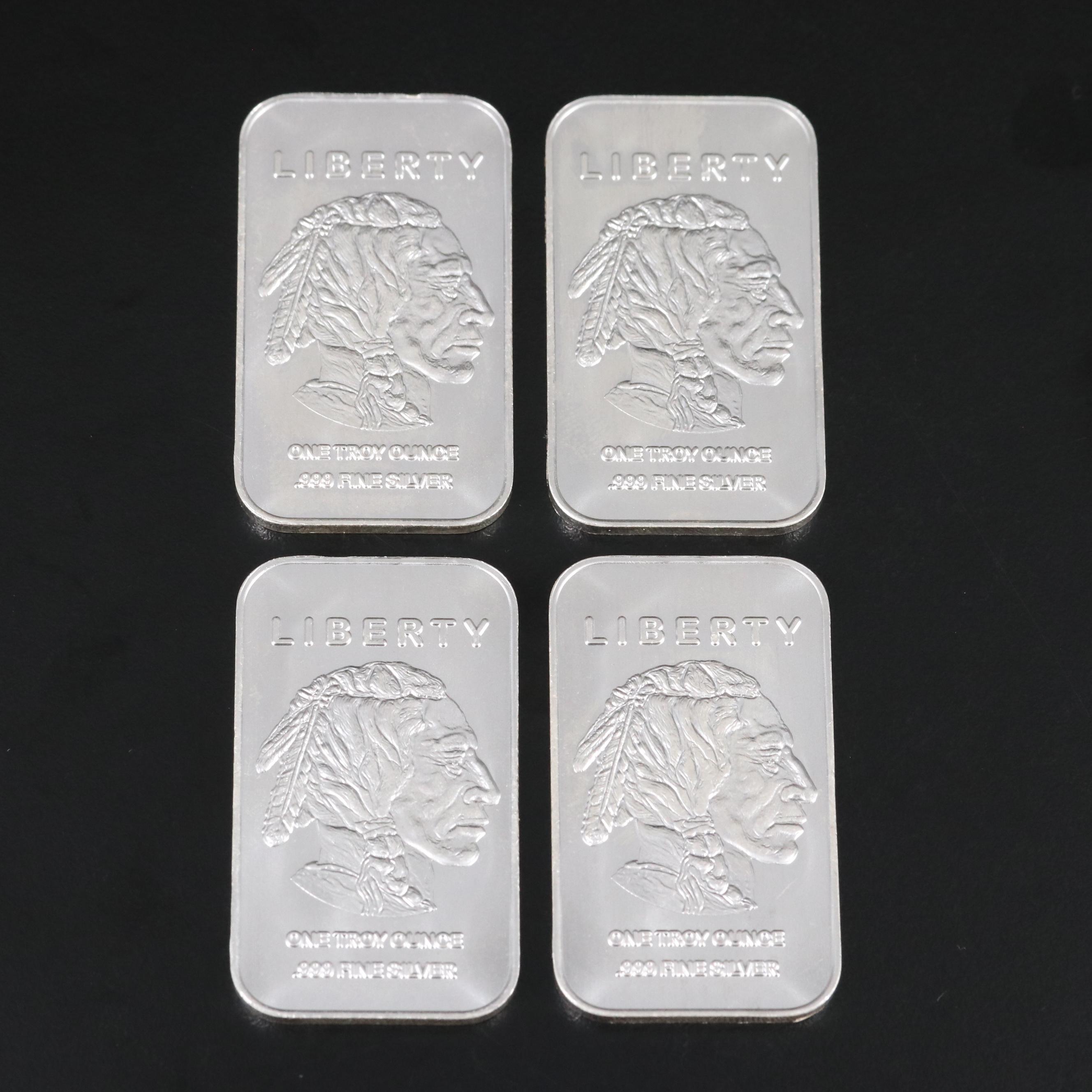 A Ten Troy Ounce and Four One Troy Ounce .999 Silver Bars