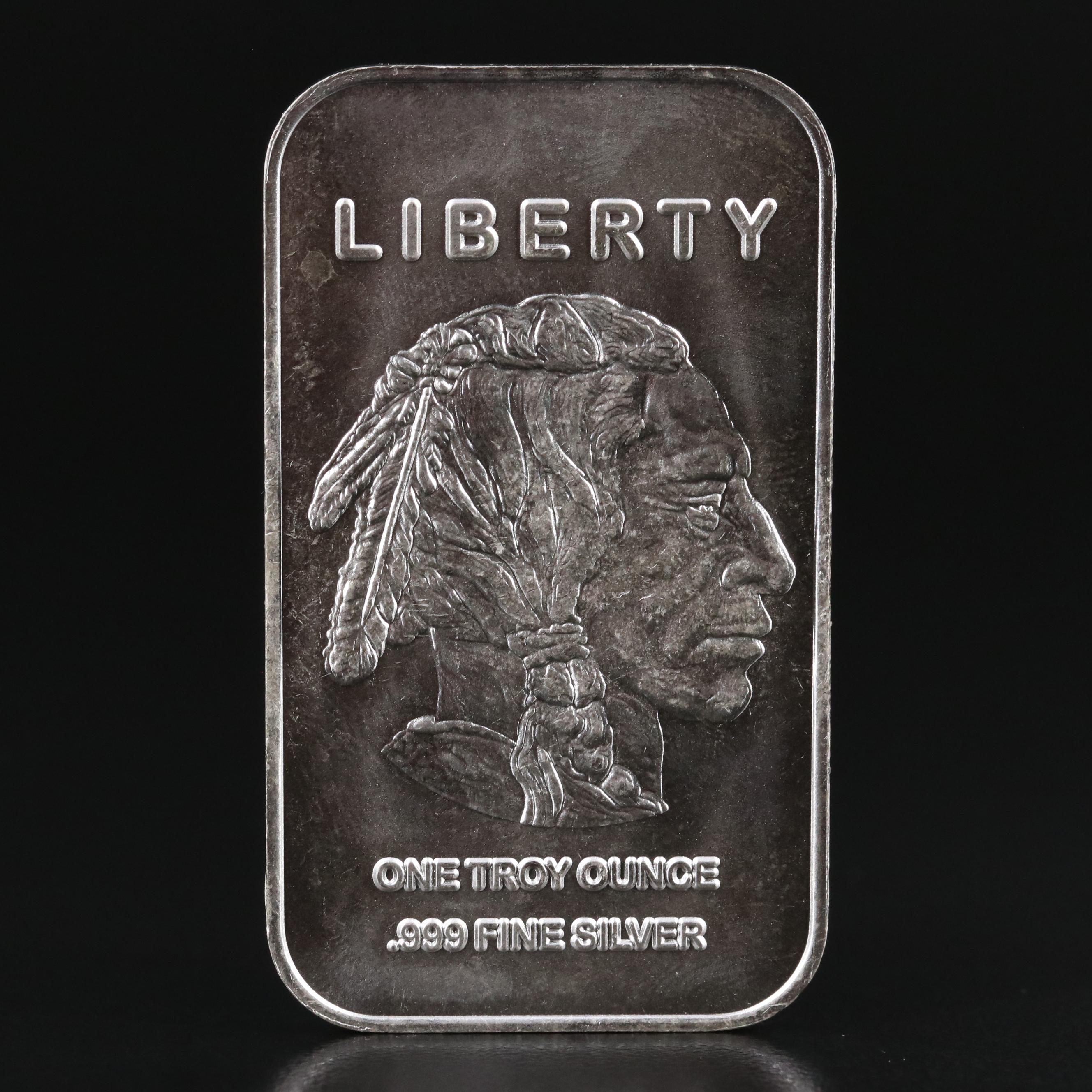 A Ten Troy Ounce and Four One Troy Ounce .999 Silver Bars