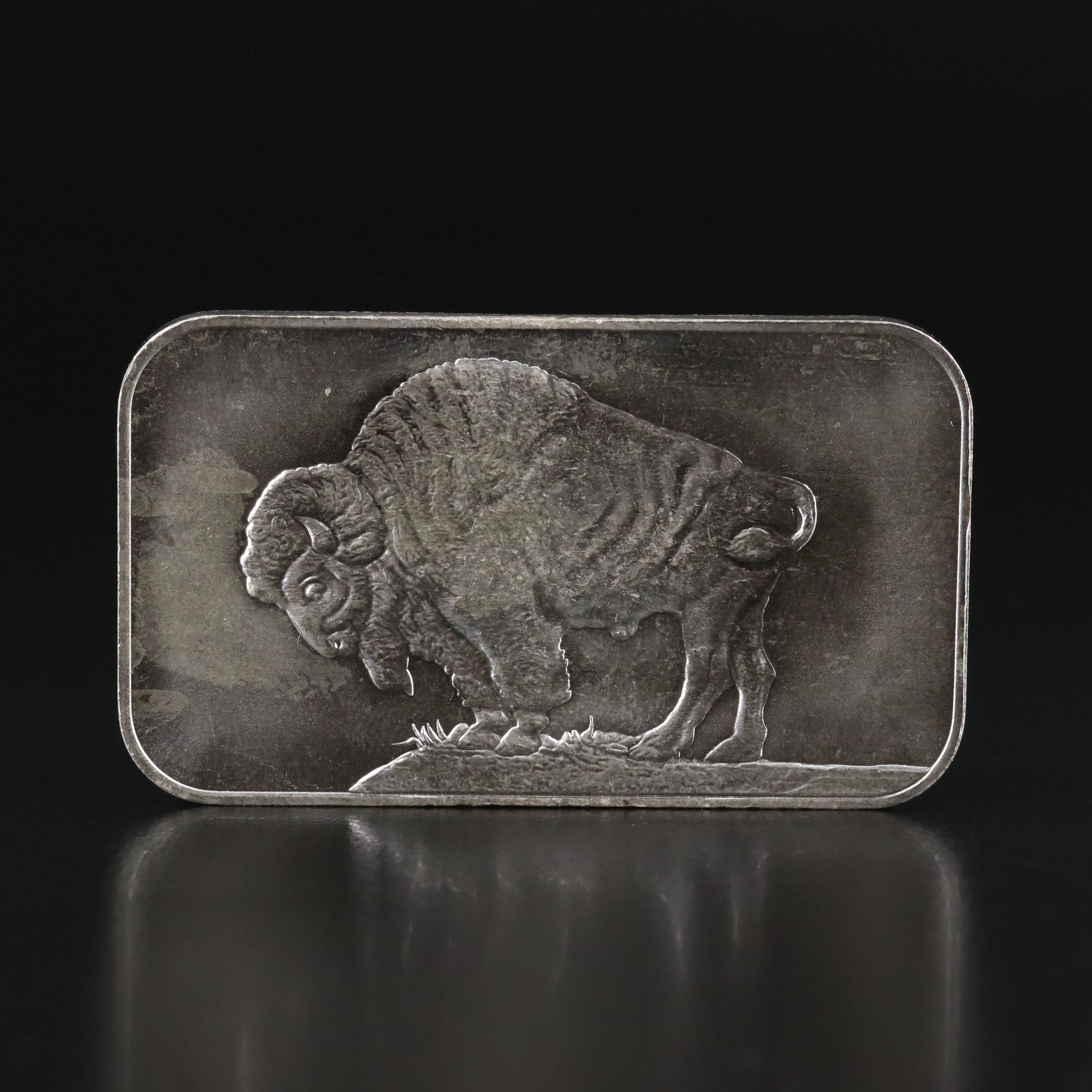 A Ten Troy Ounce and Four One Troy Ounce .999 Silver Bars