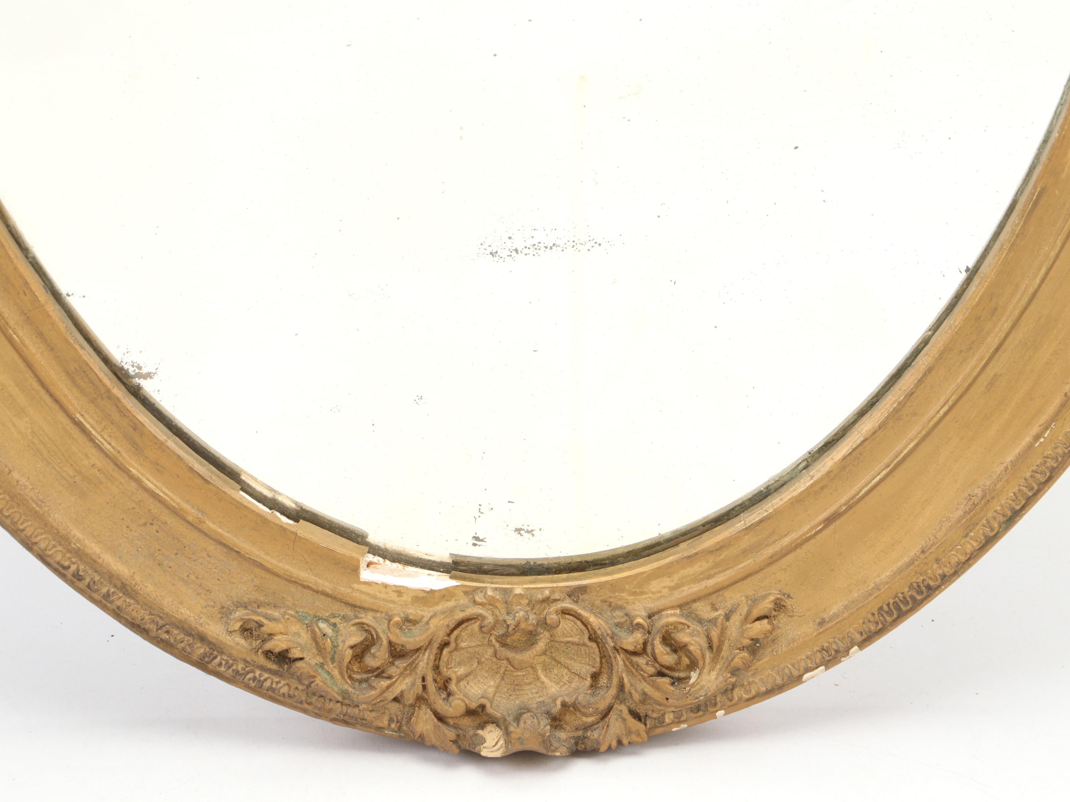 Beveled Glass Oval Mirror in Gilt Gesso Frame