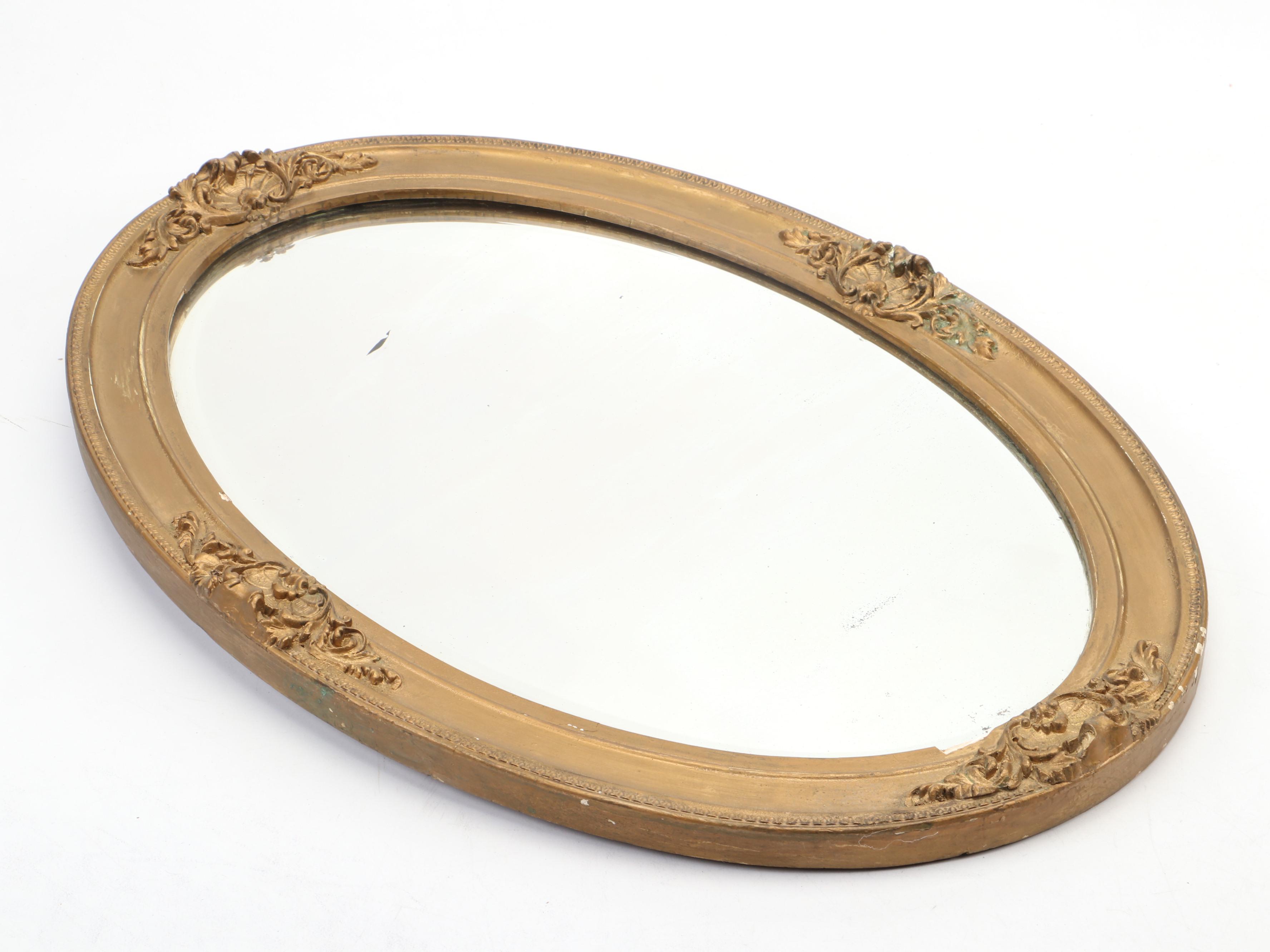 Beveled Glass Oval Mirror in Gilt Gesso Frame