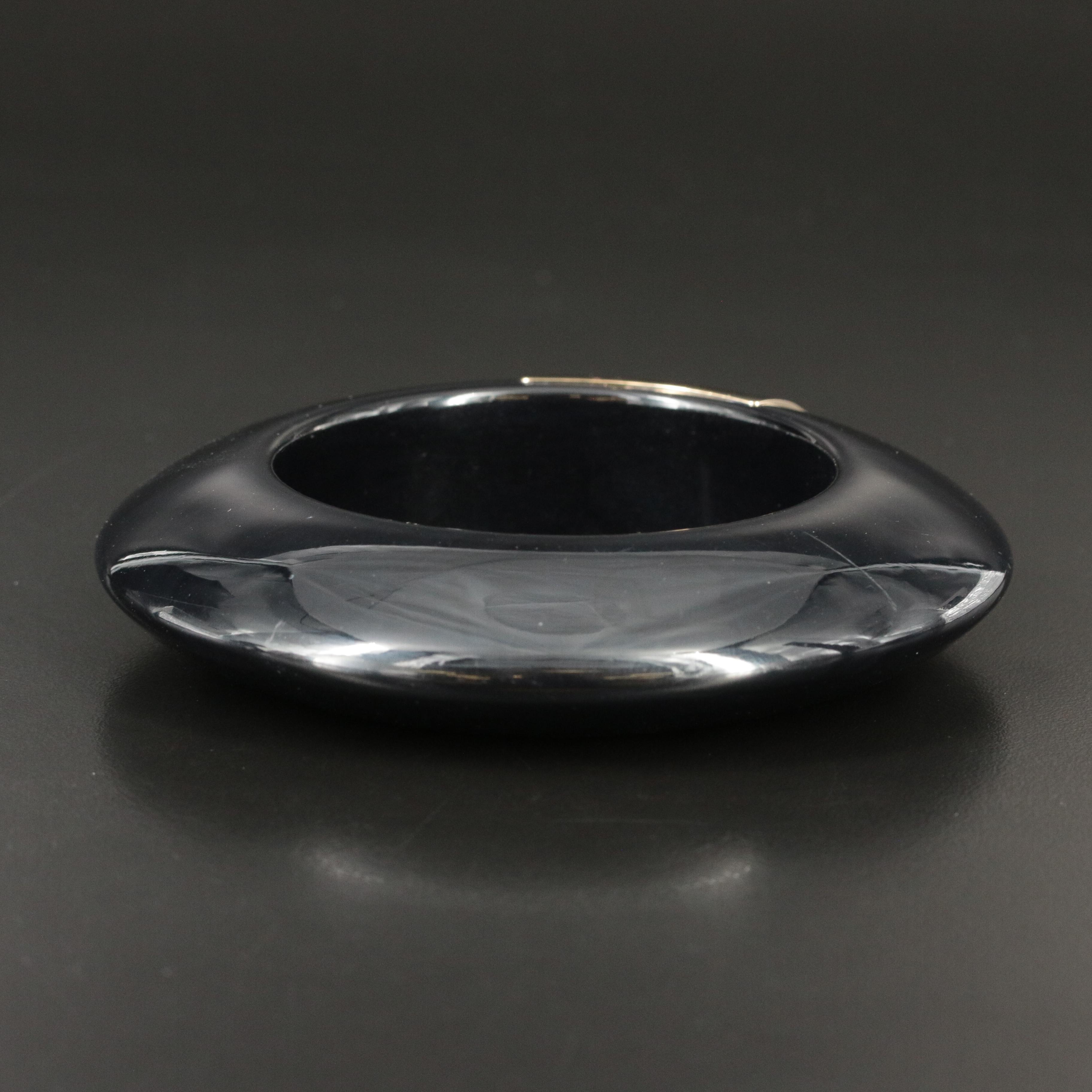 Balenciaga 'Arena', Jimmy Choo, and Tory Burch Bracelets