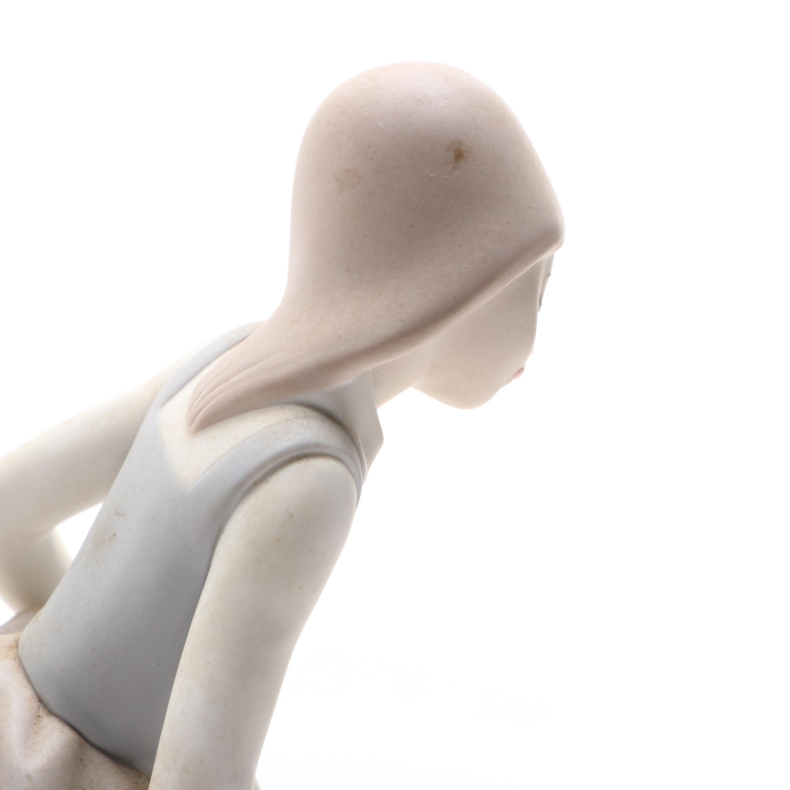 Lladró "Valencian Girl with Flowers" and "Little Girl with Cat" Figurines