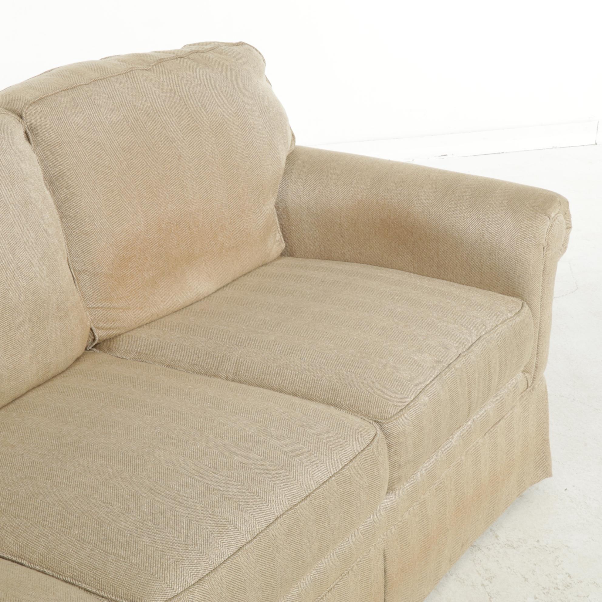 Broyhill Skirted and Roll Arm Three-Seat Sofa