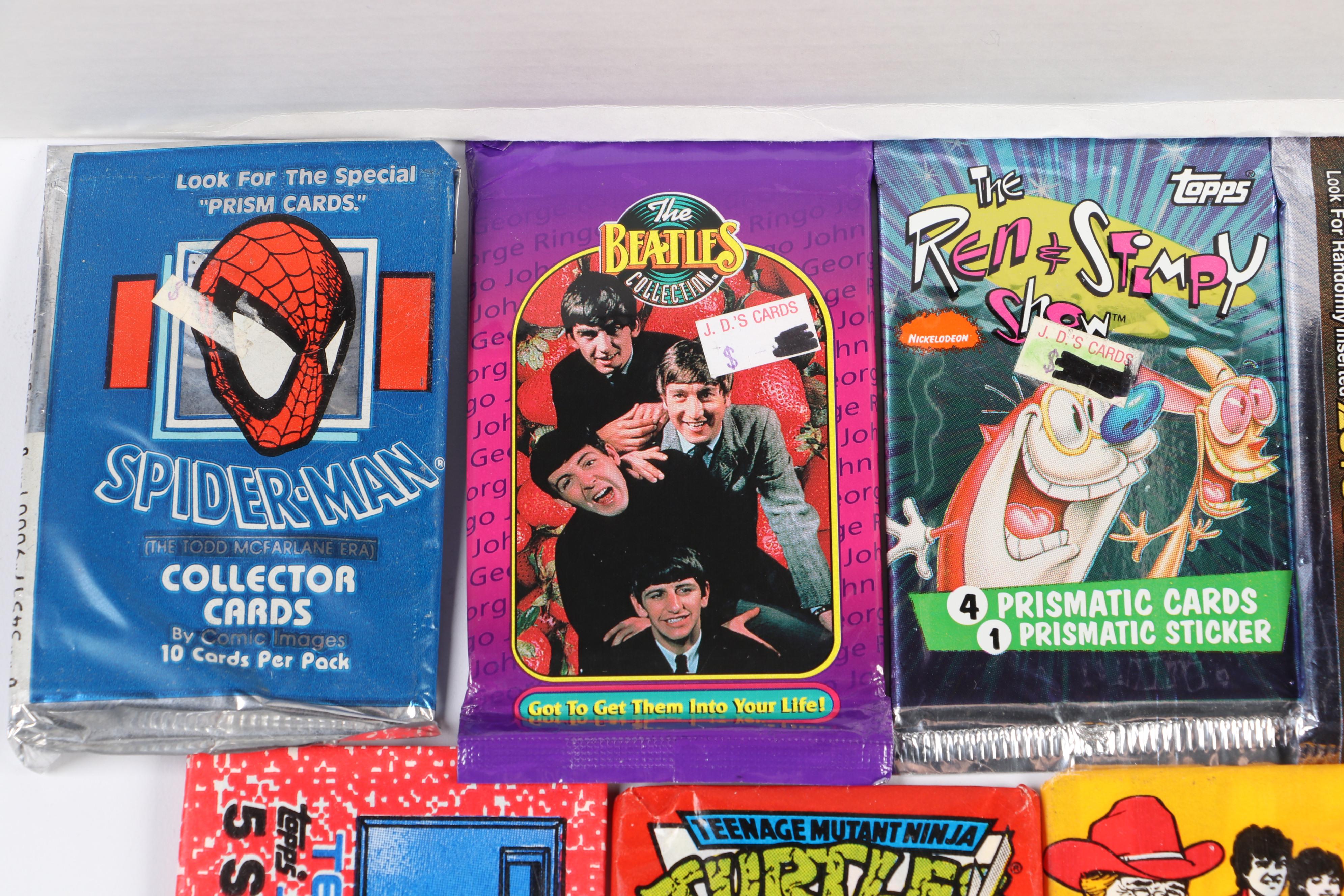 Sealed Trading Card Packs Featuring "The Beatles", "Spider-Man", and More