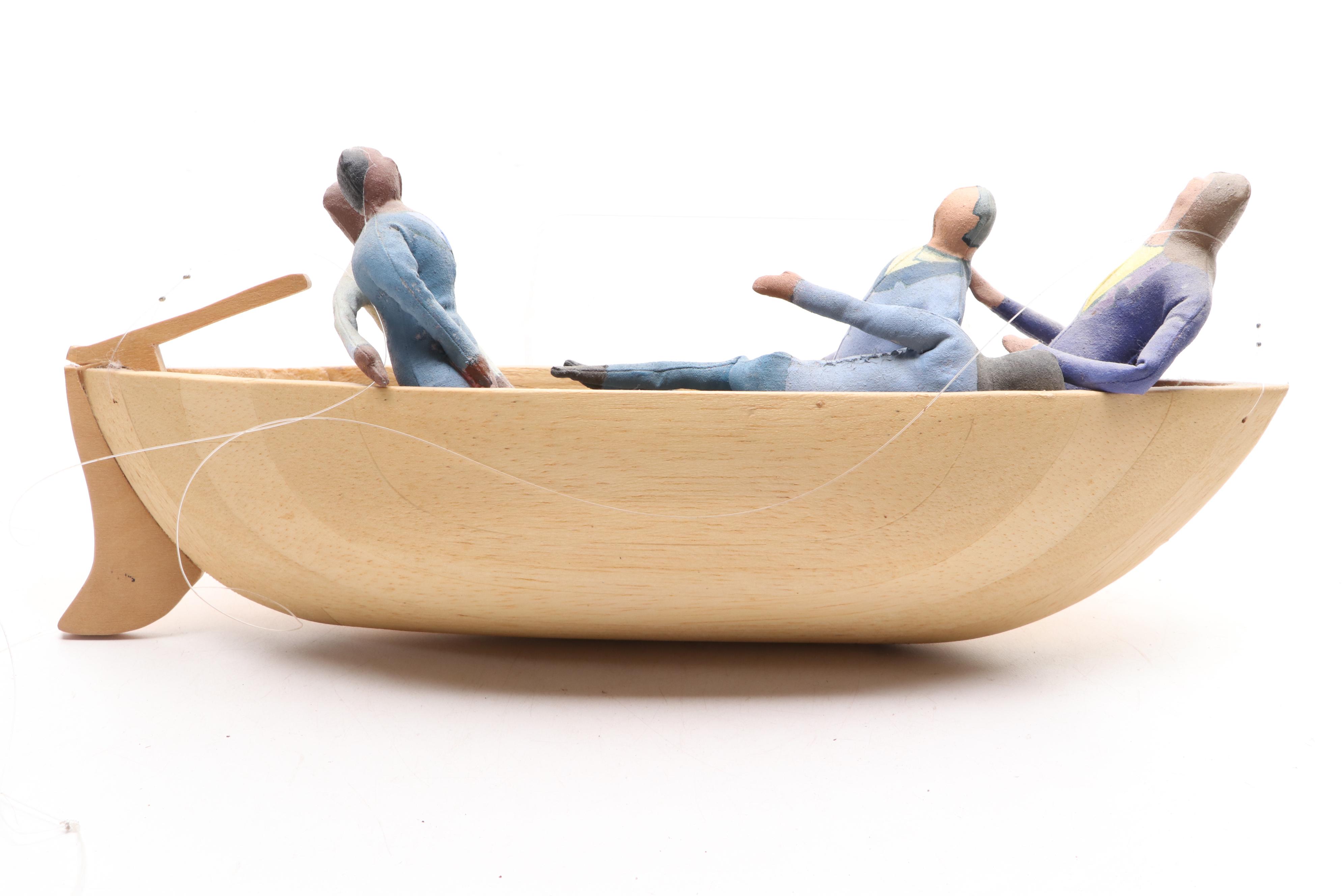 Folk Art People in Suits in a Wooden Boat