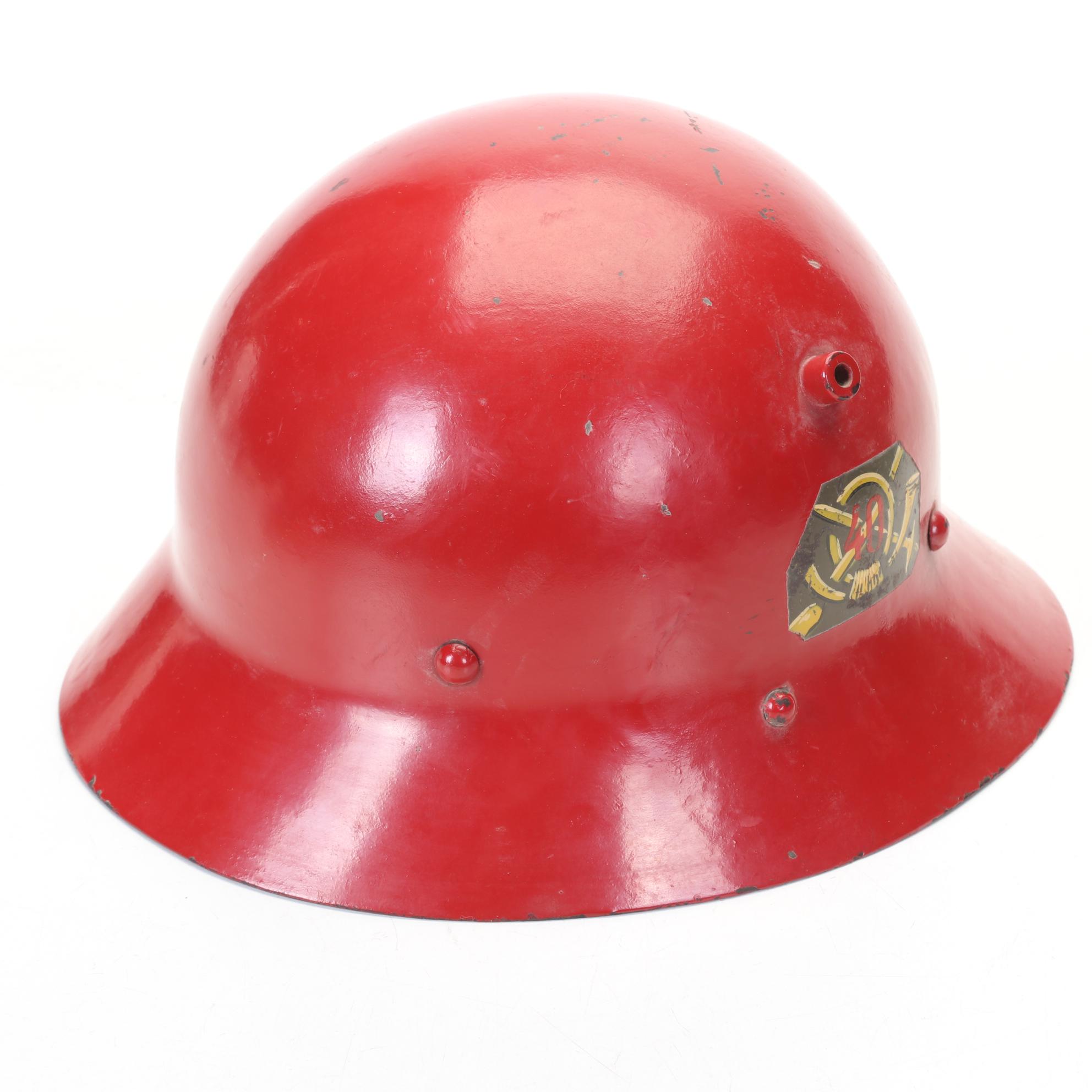 WWII Era Army and Civil Defense Helmets with Military Themed Comic Books