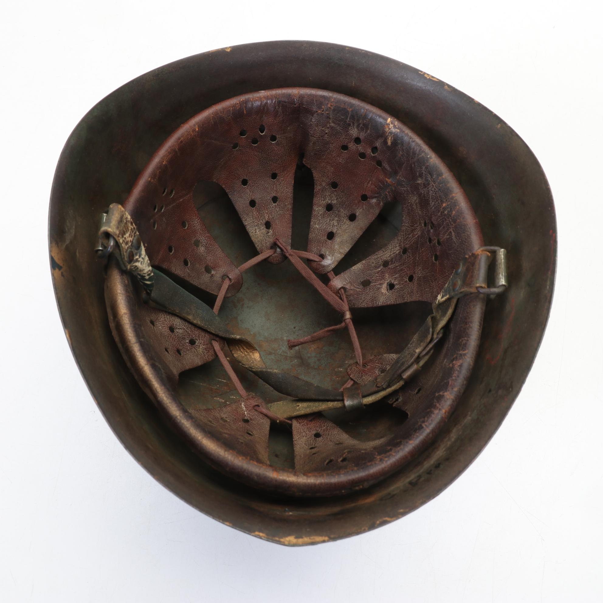 WWII Era Army and Civil Defense Helmets with Military Themed Comic Books