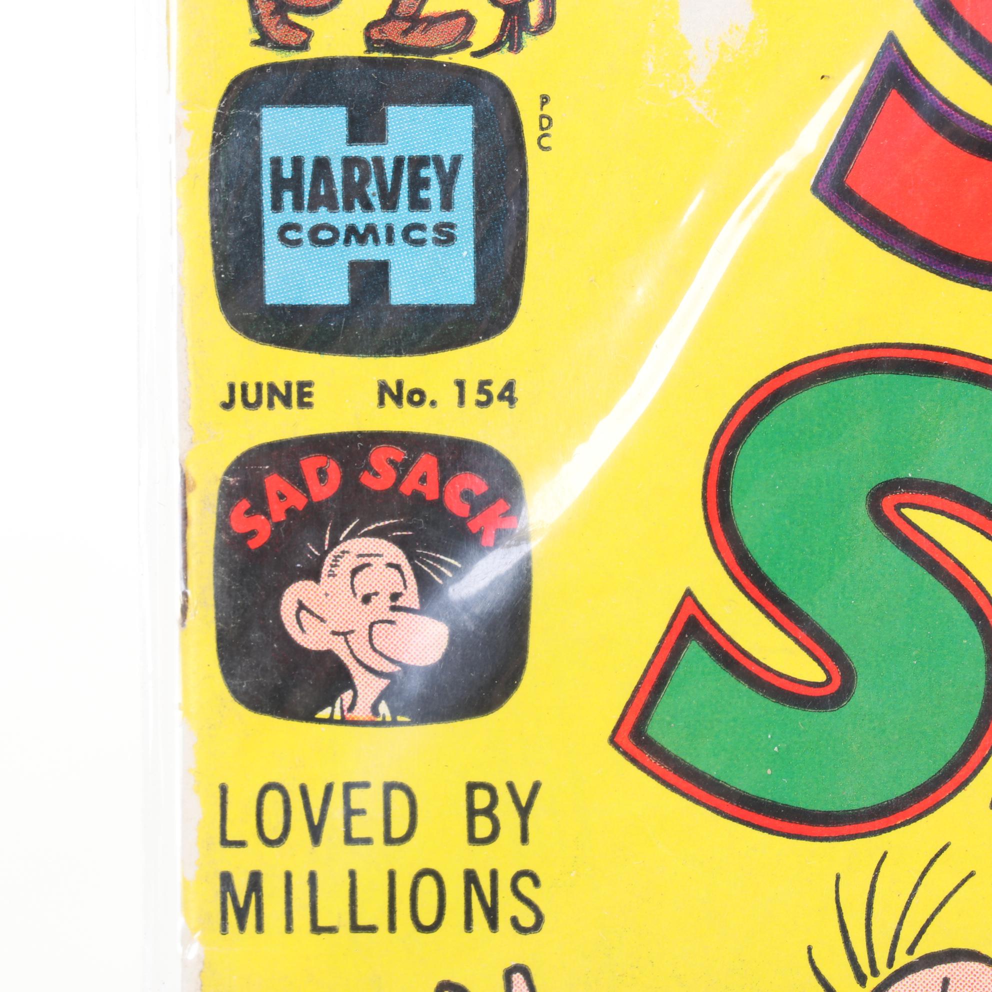 WWII Era Army and Civil Defense Helmets with Military Themed Comic Books