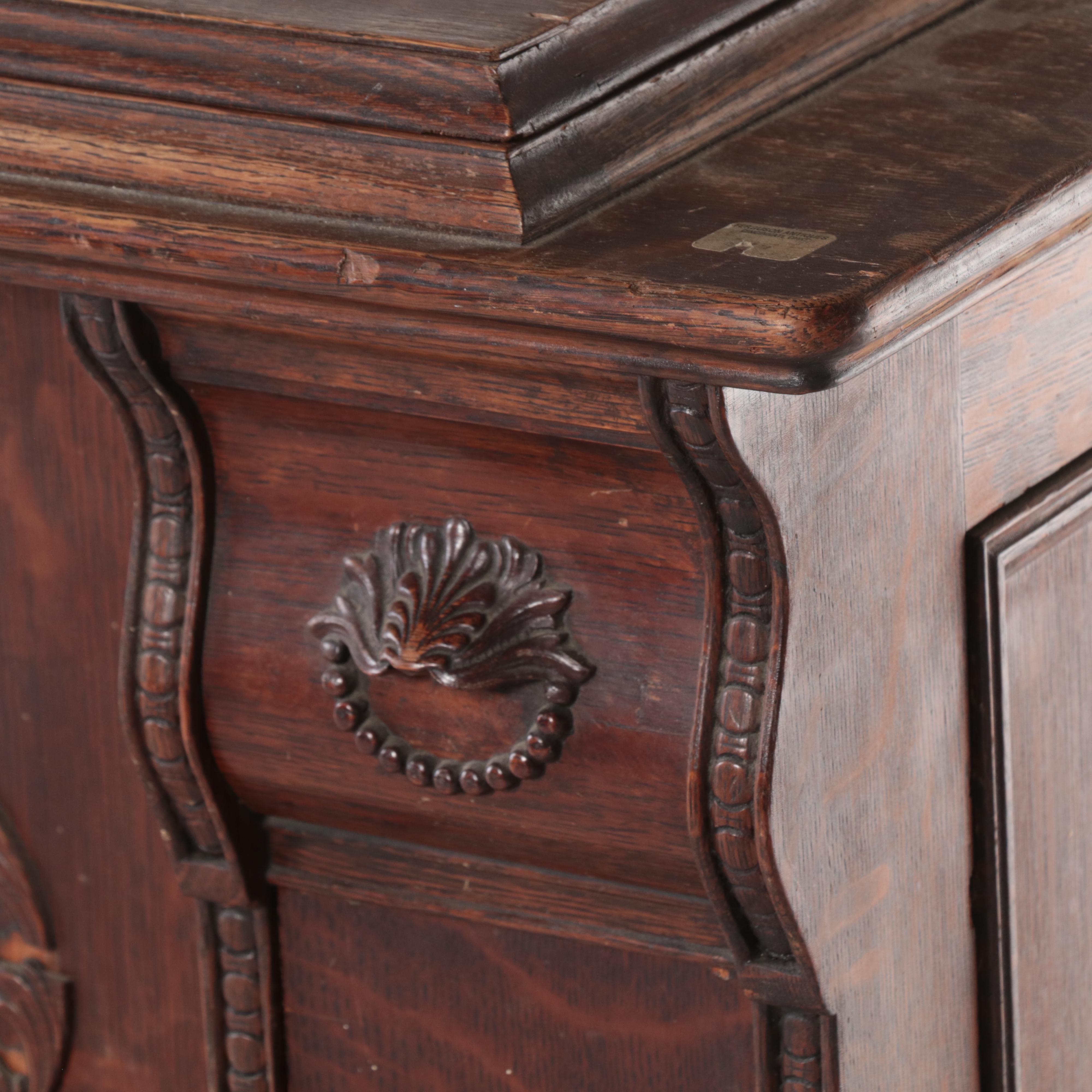 The Singer Mfg. Co Egyptian Revival Treadle-Base Sewing Machine in Oak Cabinet