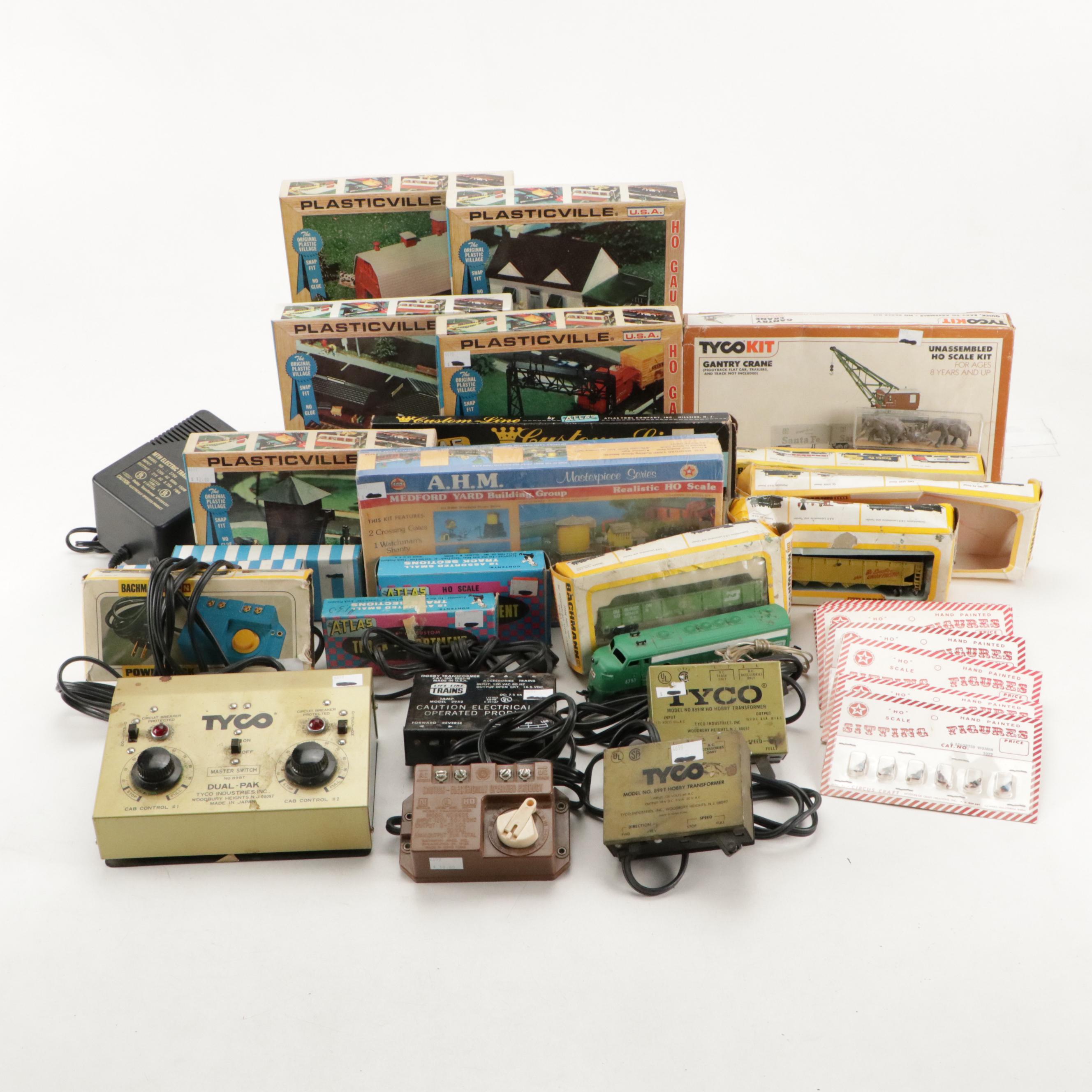 Tyco and Other Transformers with Assorted Train Cars, Tracks, and Accessories