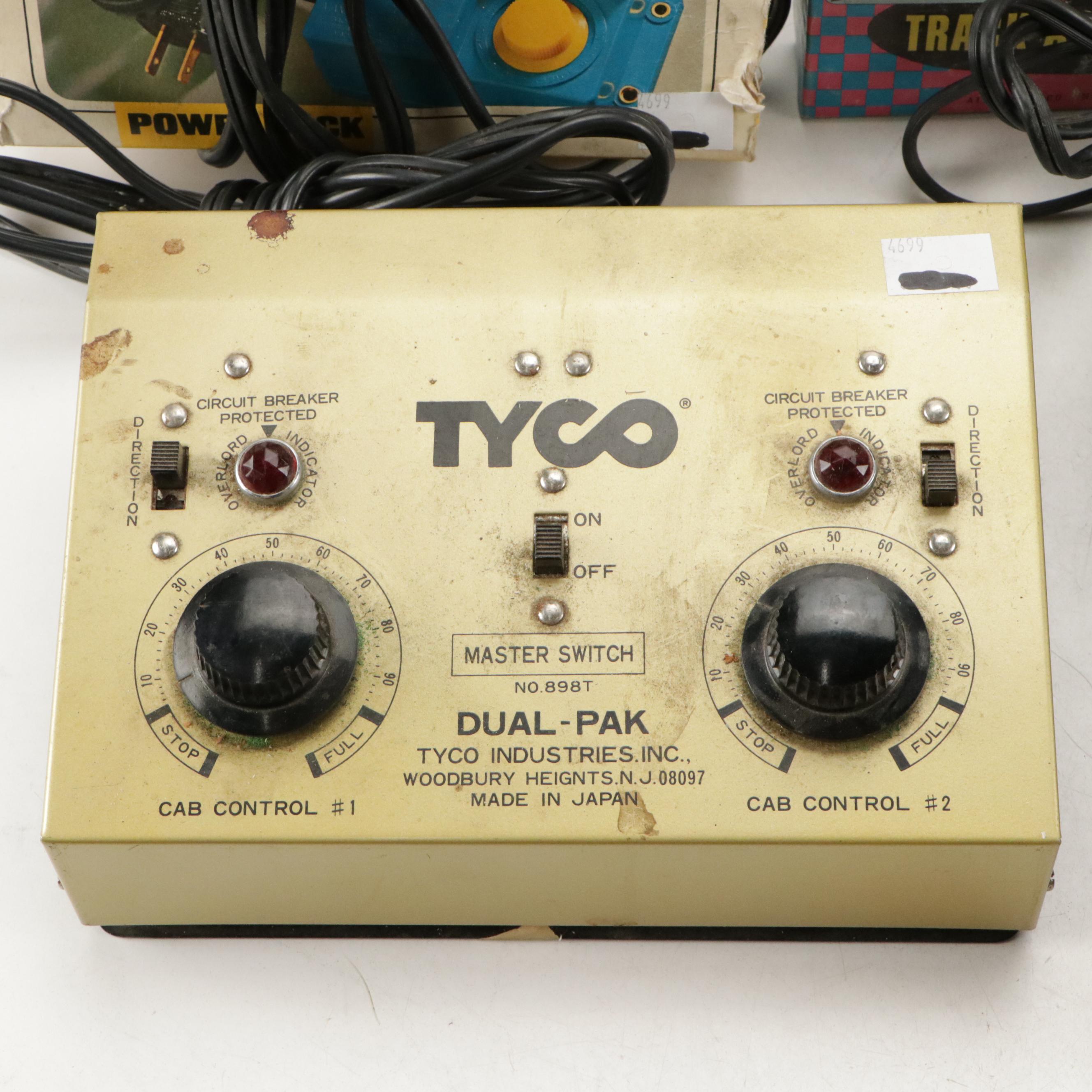 Tyco and Other Transformers with Assorted Train Cars, Tracks, and Accessories