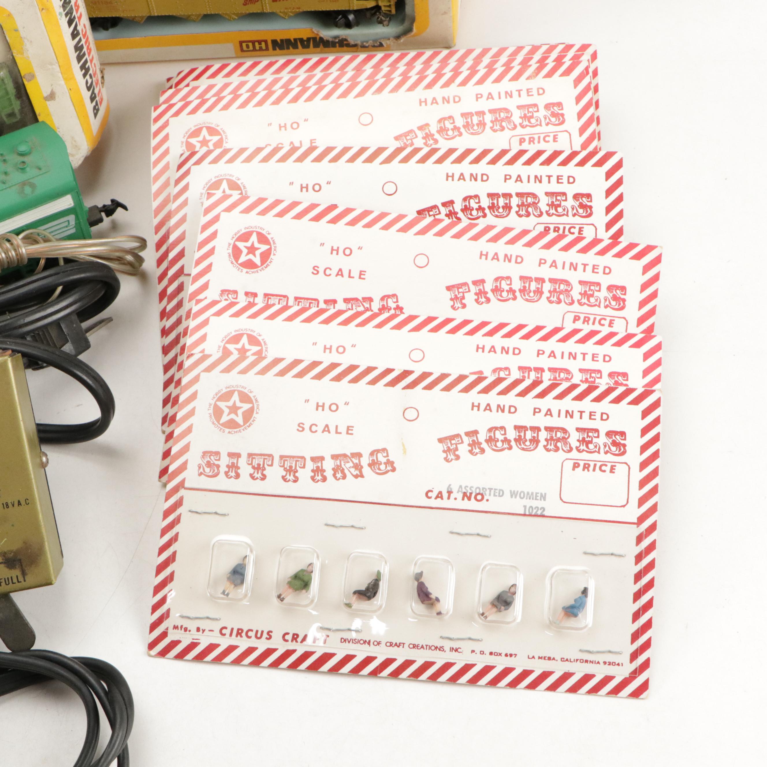 Tyco and Other Transformers with Assorted Train Cars, Tracks, and Accessories