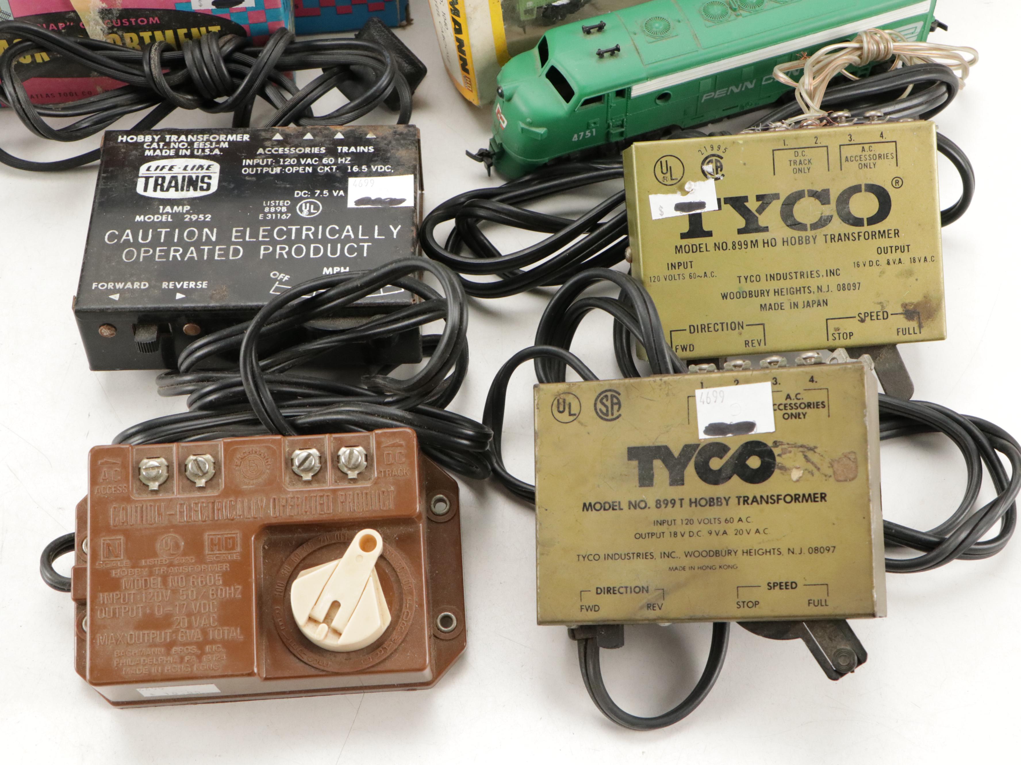 Tyco and Other Transformers with Assorted Train Cars, Tracks, and Accessories