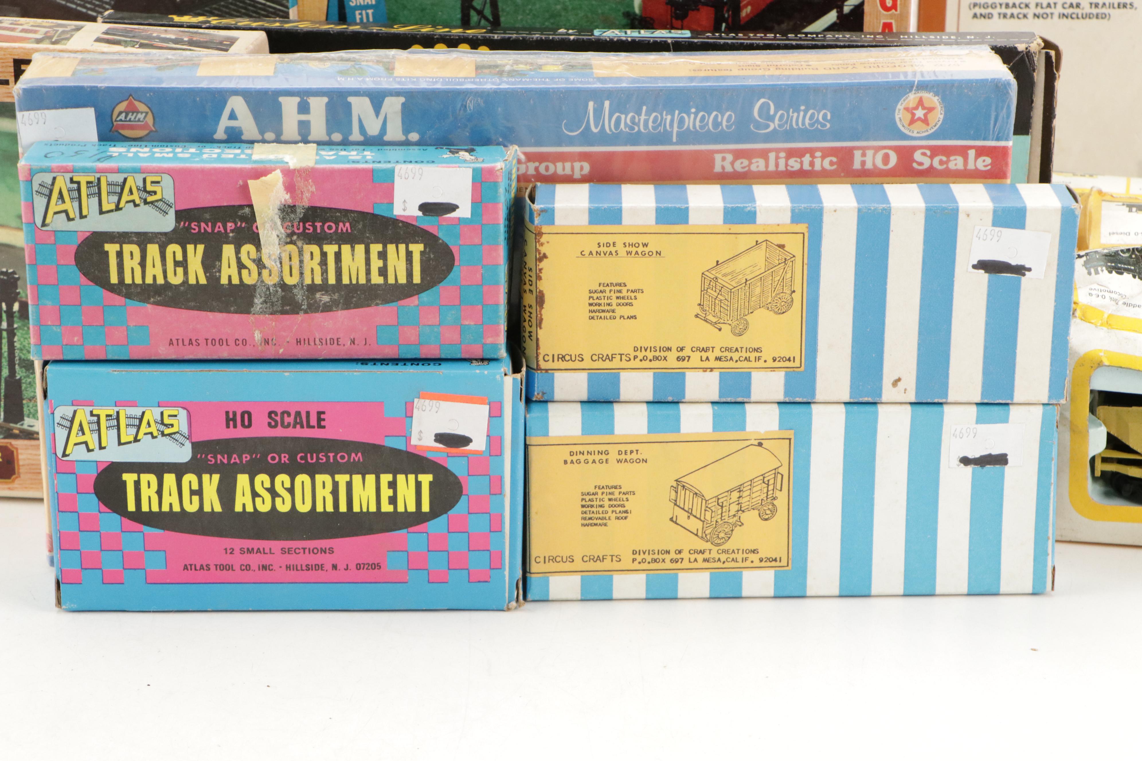 Tyco and Other Transformers with Assorted Train Cars, Tracks, and Accessories