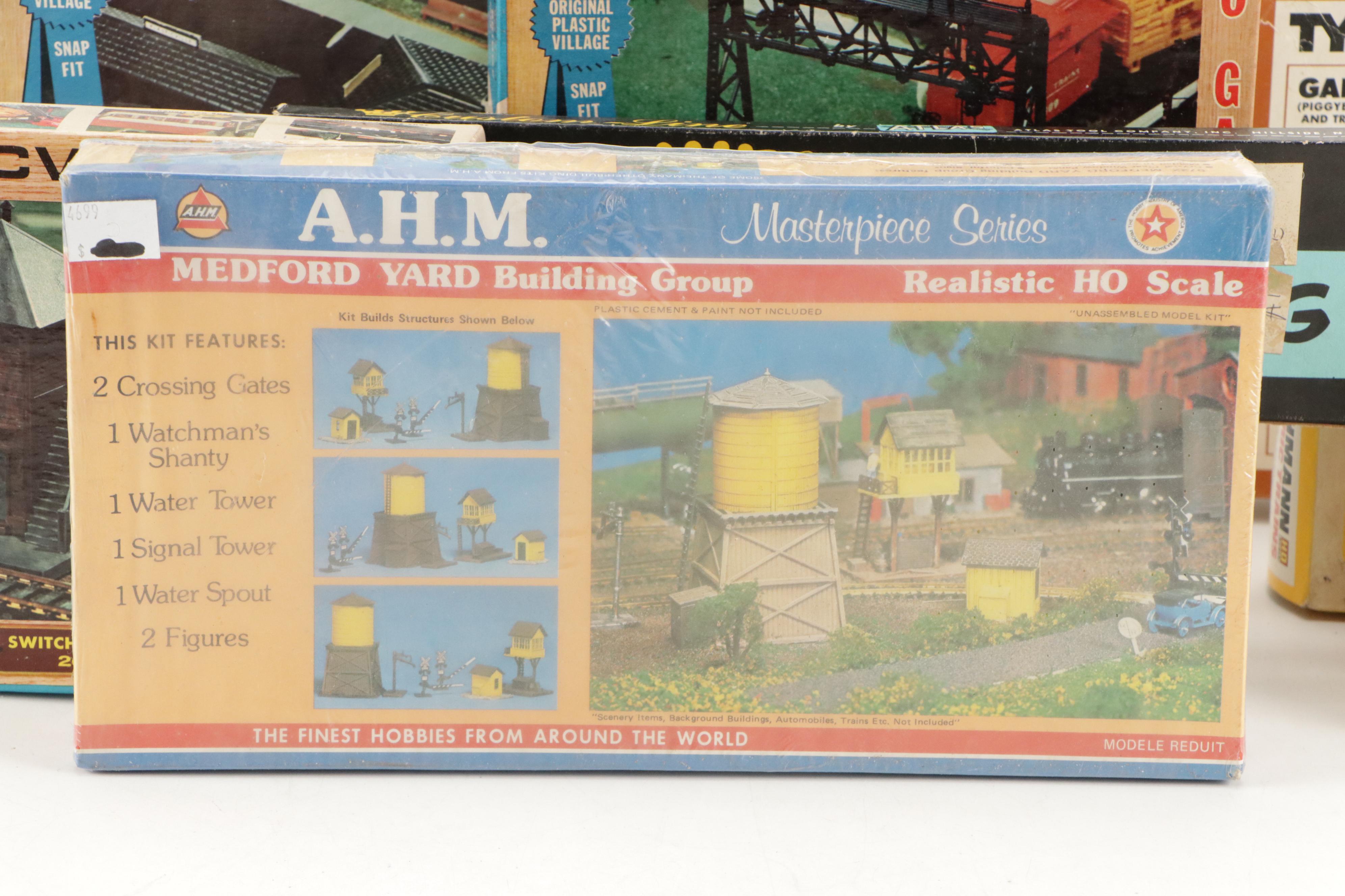 Tyco and Other Transformers with Assorted Train Cars, Tracks, and Accessories