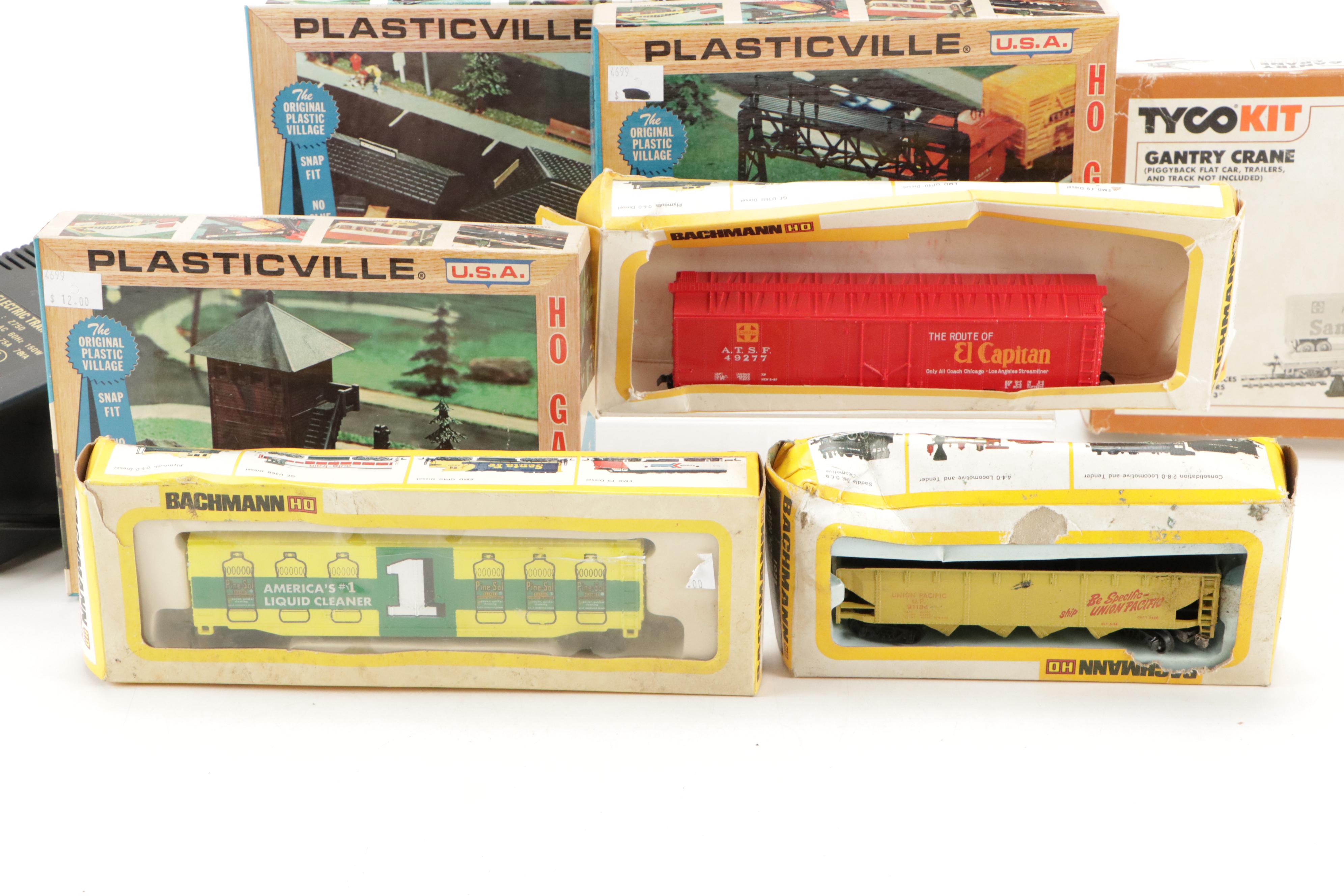 Tyco and Other Transformers with Assorted Train Cars, Tracks, and Accessories