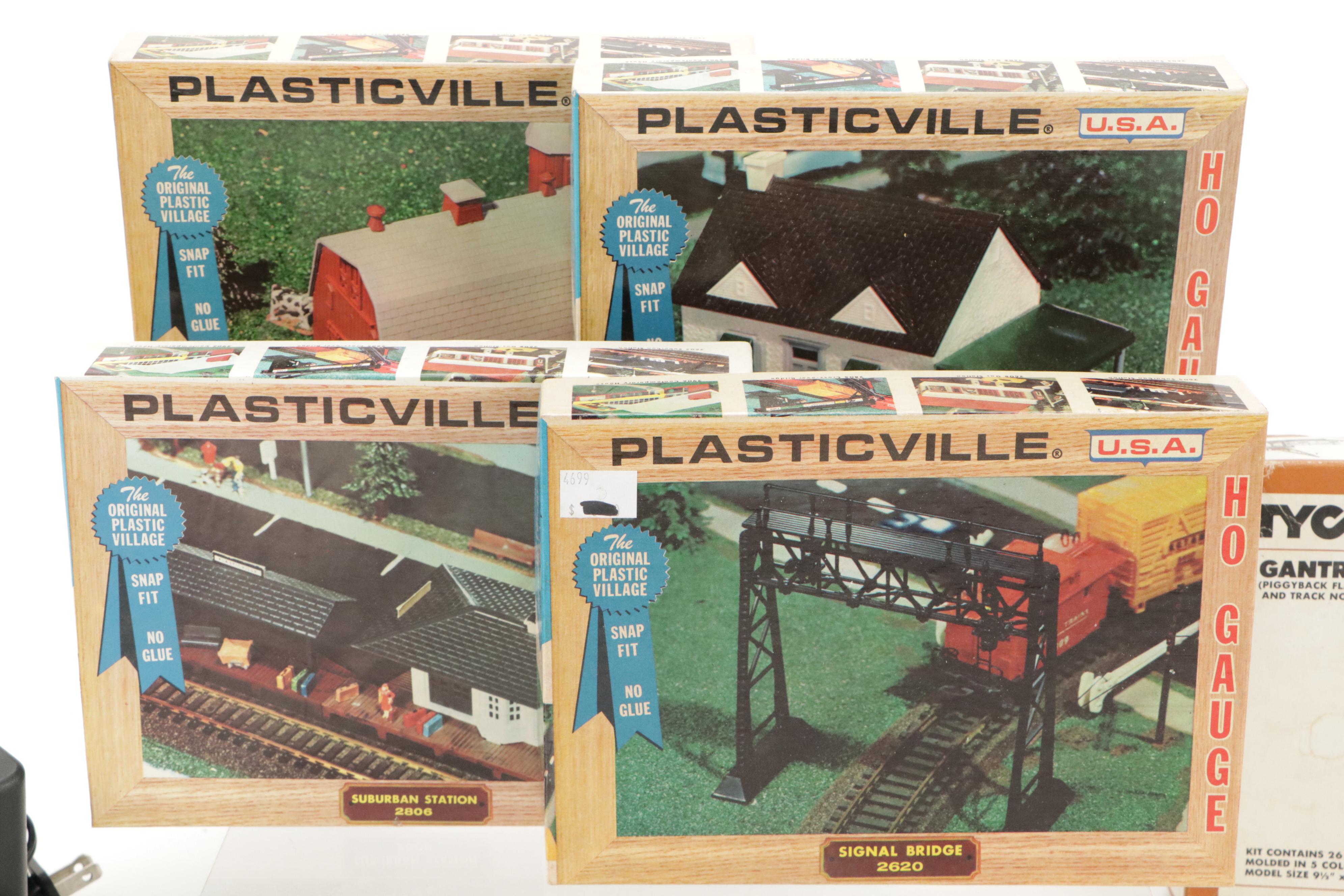 Tyco and Other Transformers with Assorted Train Cars, Tracks, and Accessories