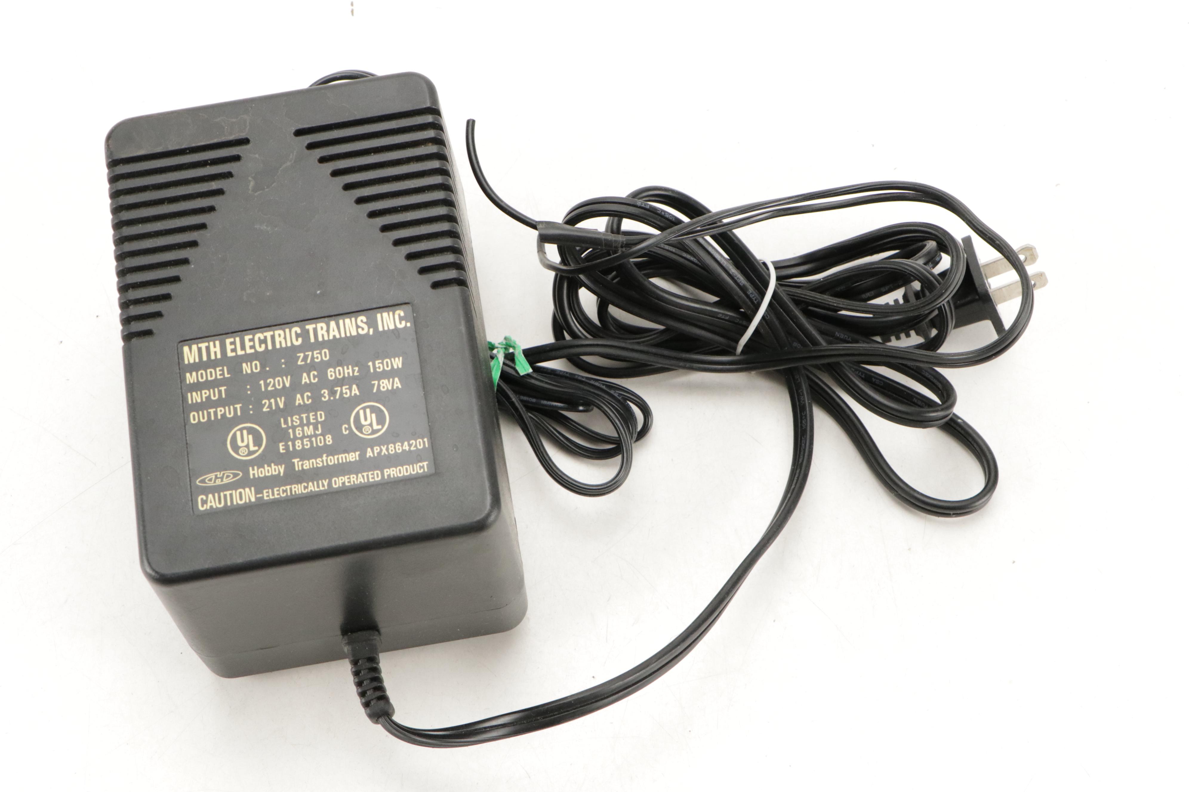 Tyco and Other Transformers with Assorted Train Cars, Tracks, and Accessories