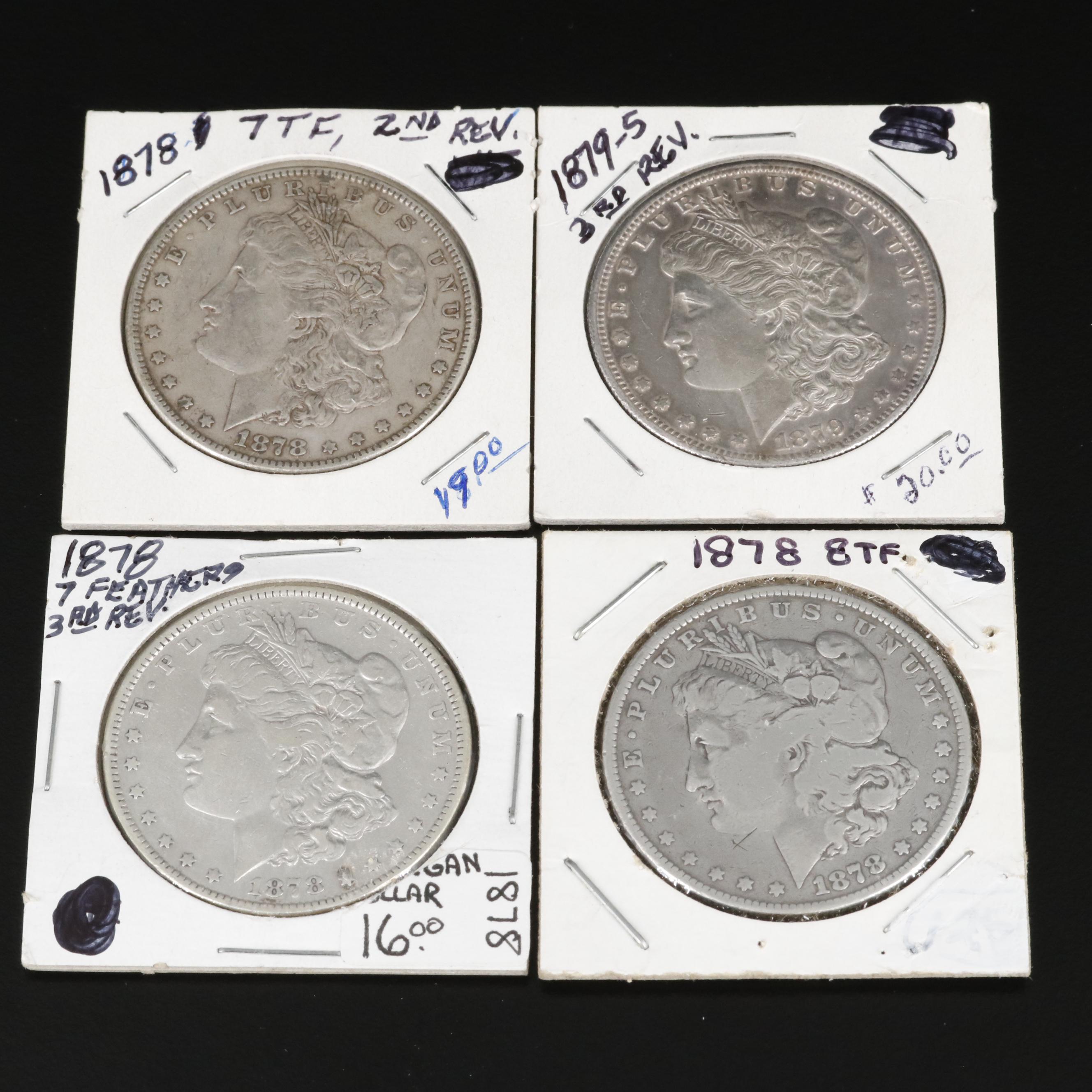Four Different Morgan Dollars With an 1878 8 Feathers