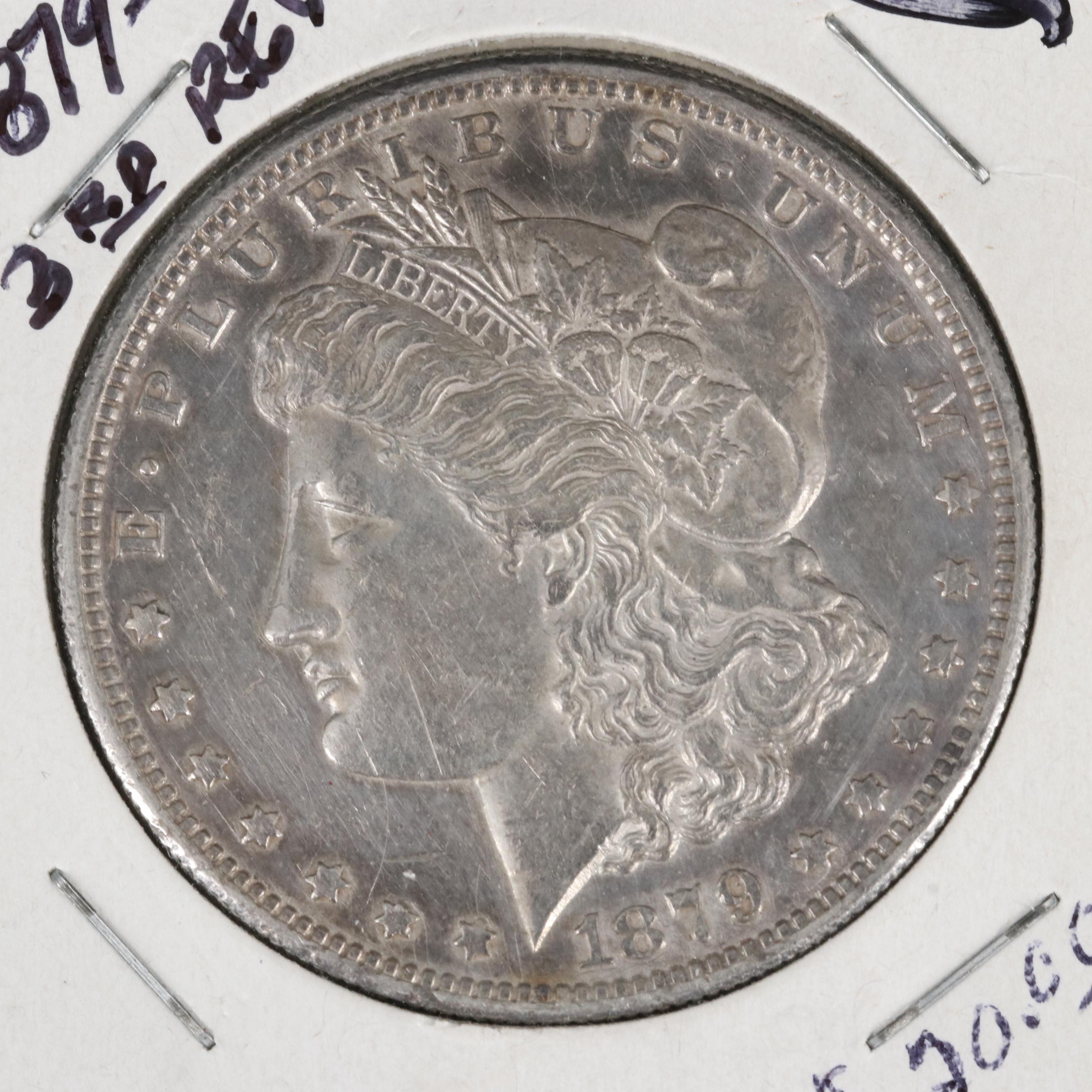 Four Different Morgan Dollars With an 1878 8 Feathers