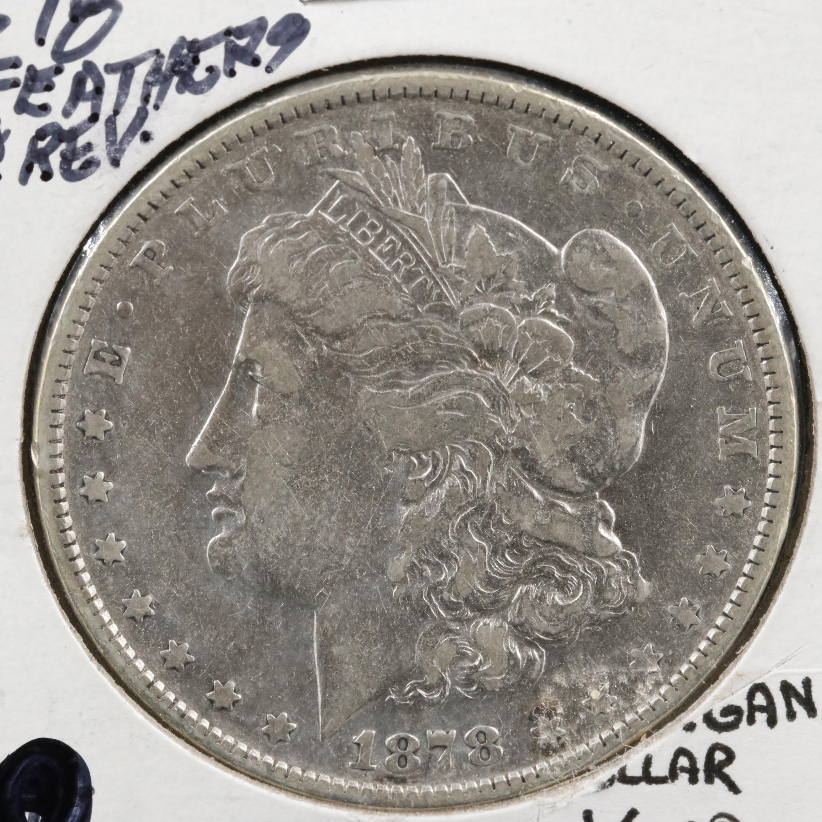 Four Different Morgan Dollars With an 1878 8 Feathers