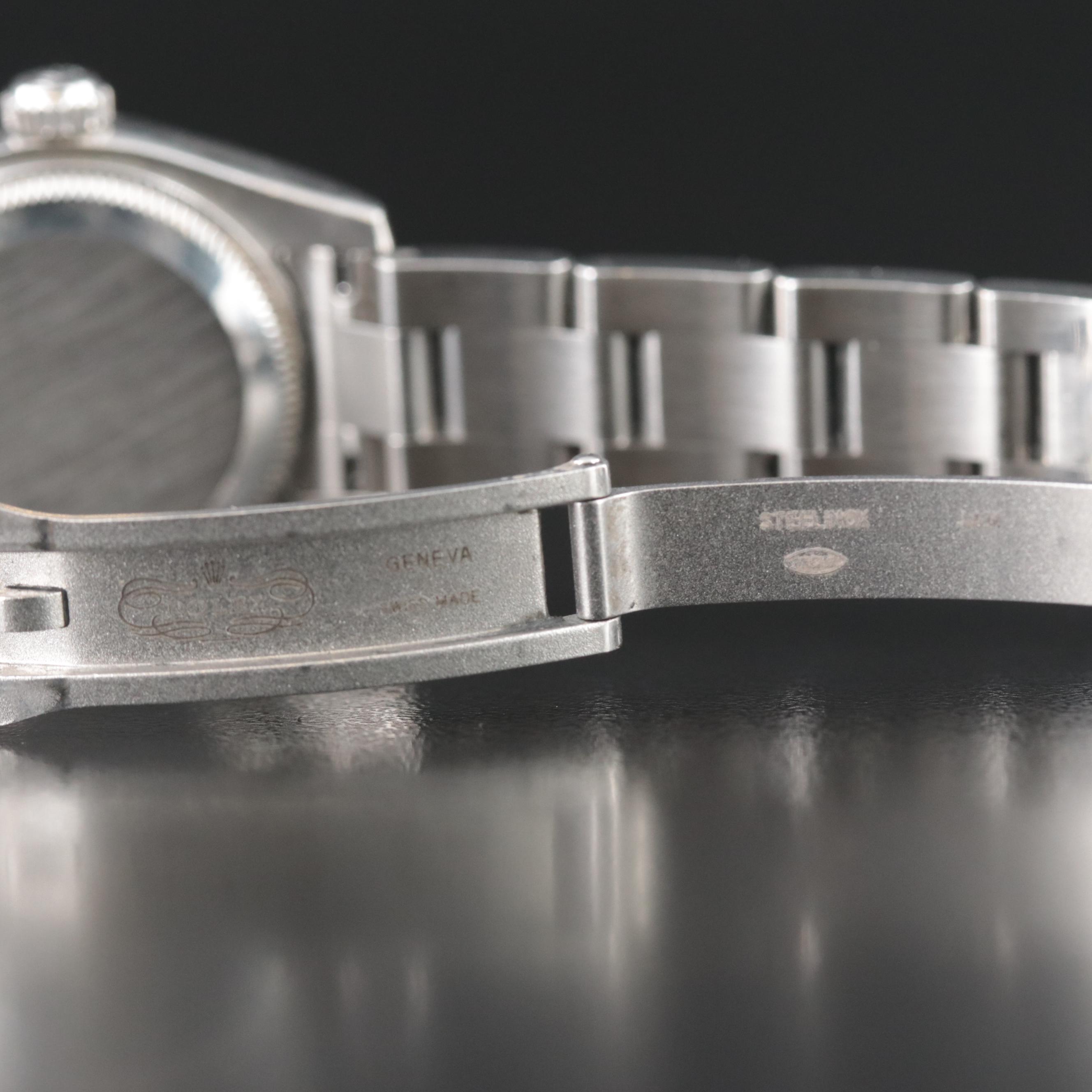 Rolex Oyster Perpetual White Arabic Dial Watch