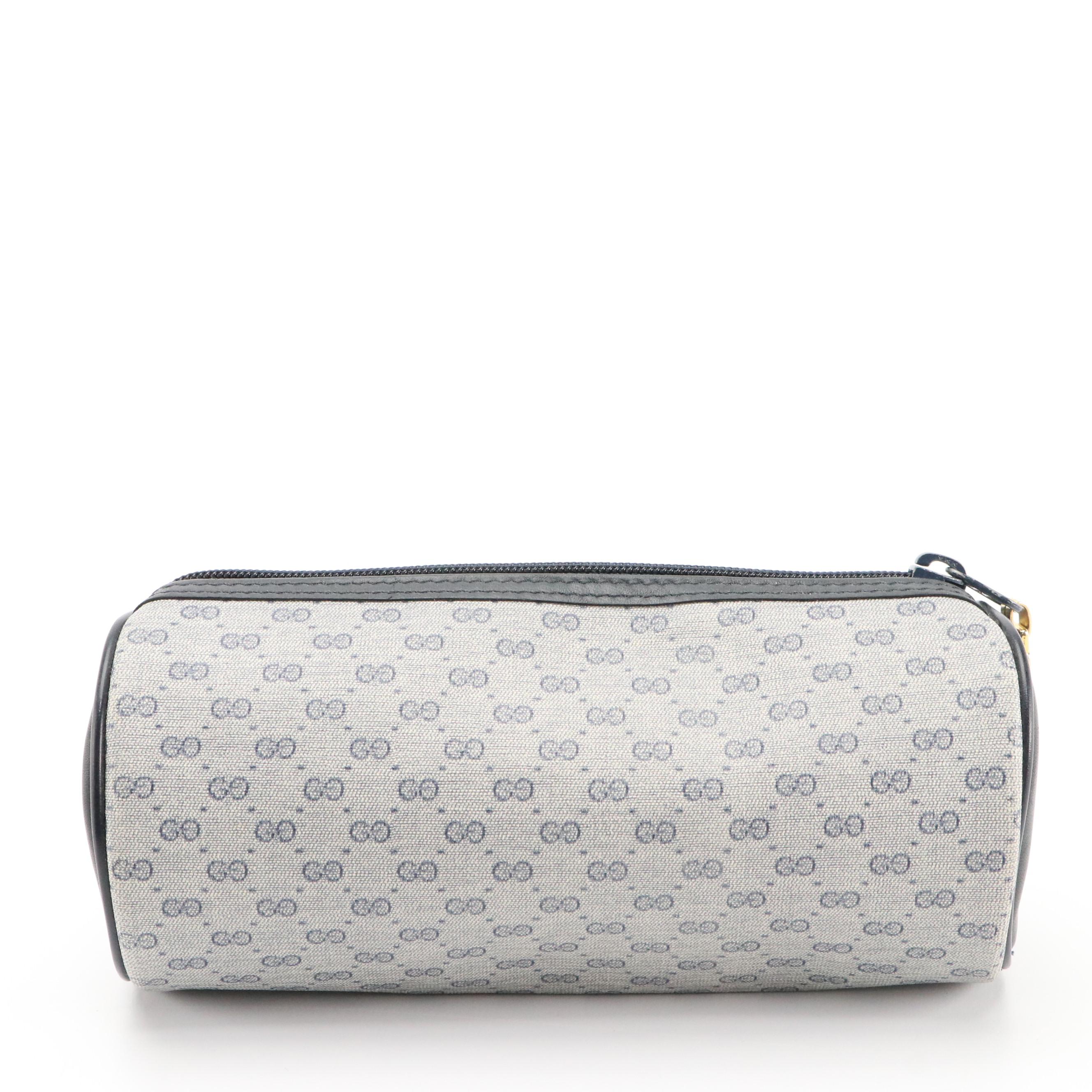 Louis Vuitton Zip Clutch, Gucci GG Supreme Barrel Pouch, Saks Embossed Folder