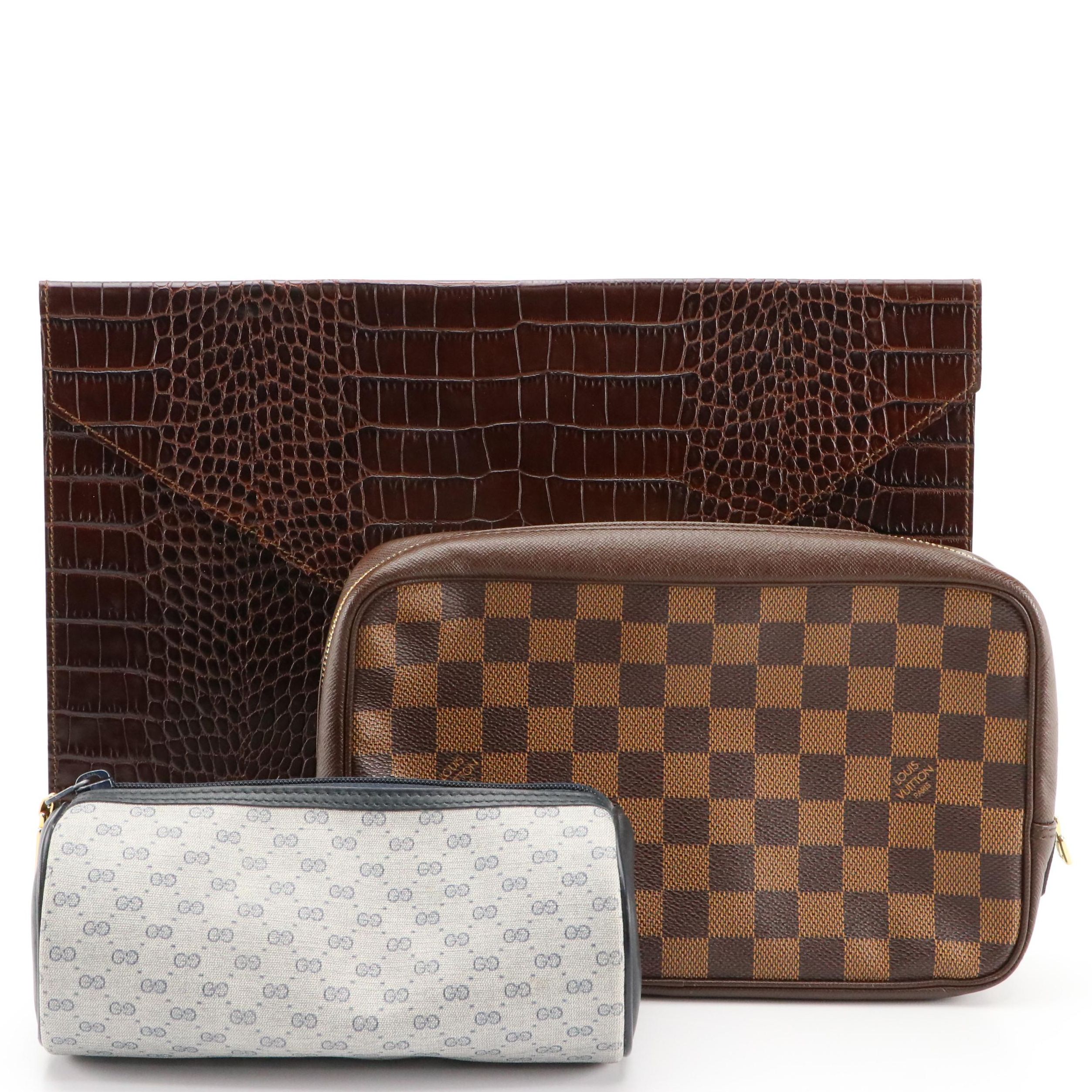Louis Vuitton Zip Clutch, Gucci GG Supreme Barrel Pouch, Saks Embossed Folder