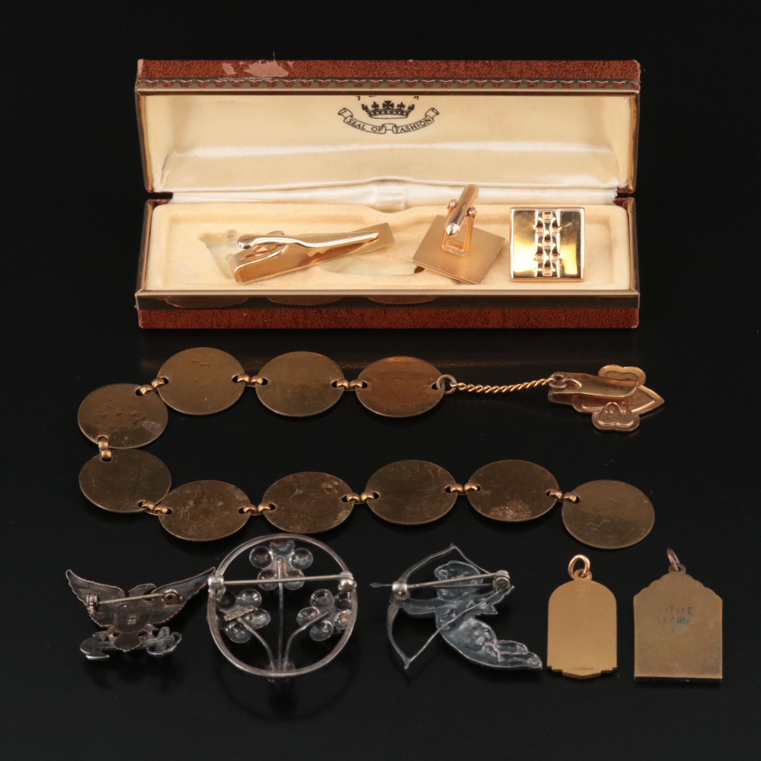 Sterling Cupid Brooch and US Navy Pin Featured in Vintage Jewelry