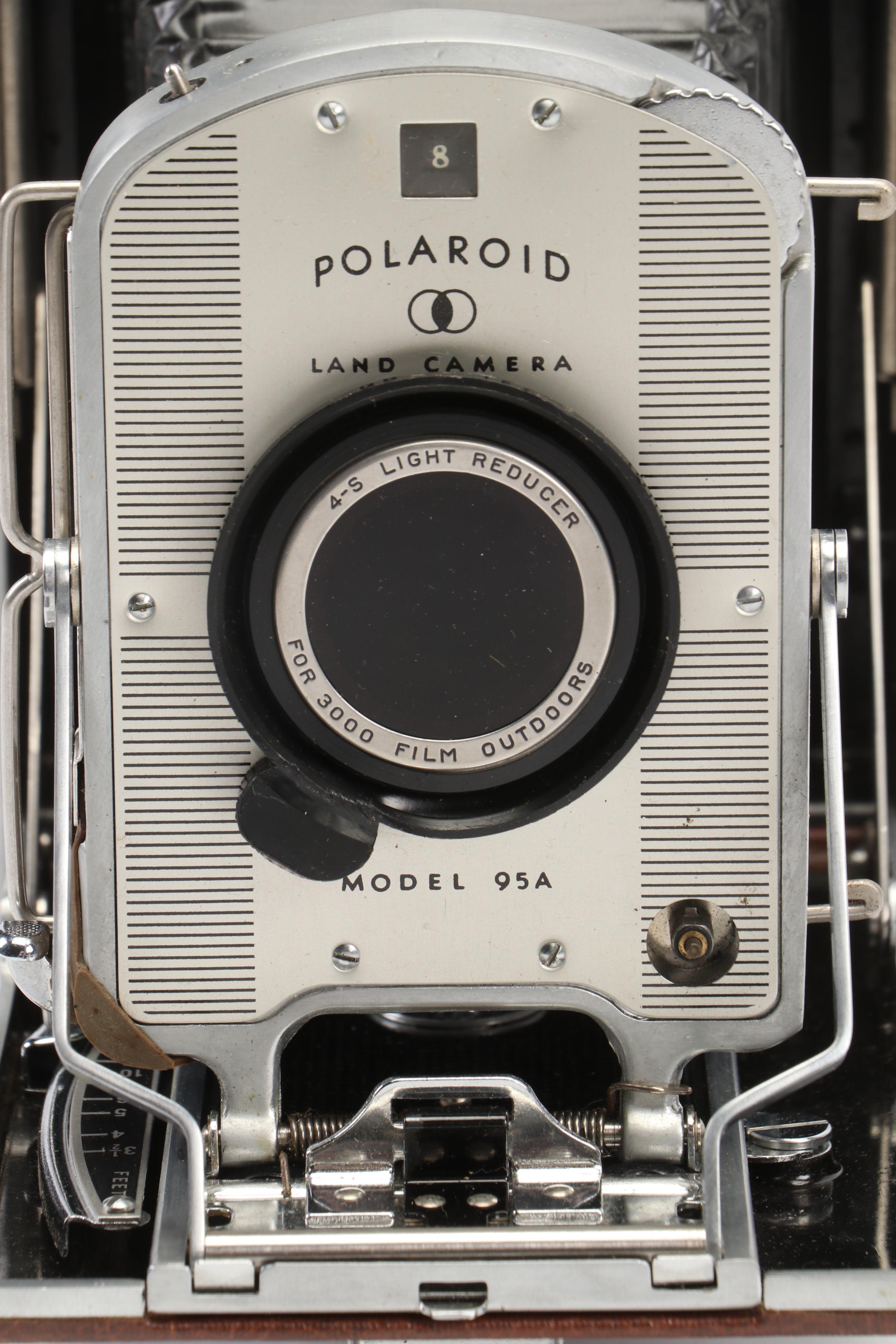 Polaroid Land Camera Automatic 100 and Model 95A with Flashes and Accessories