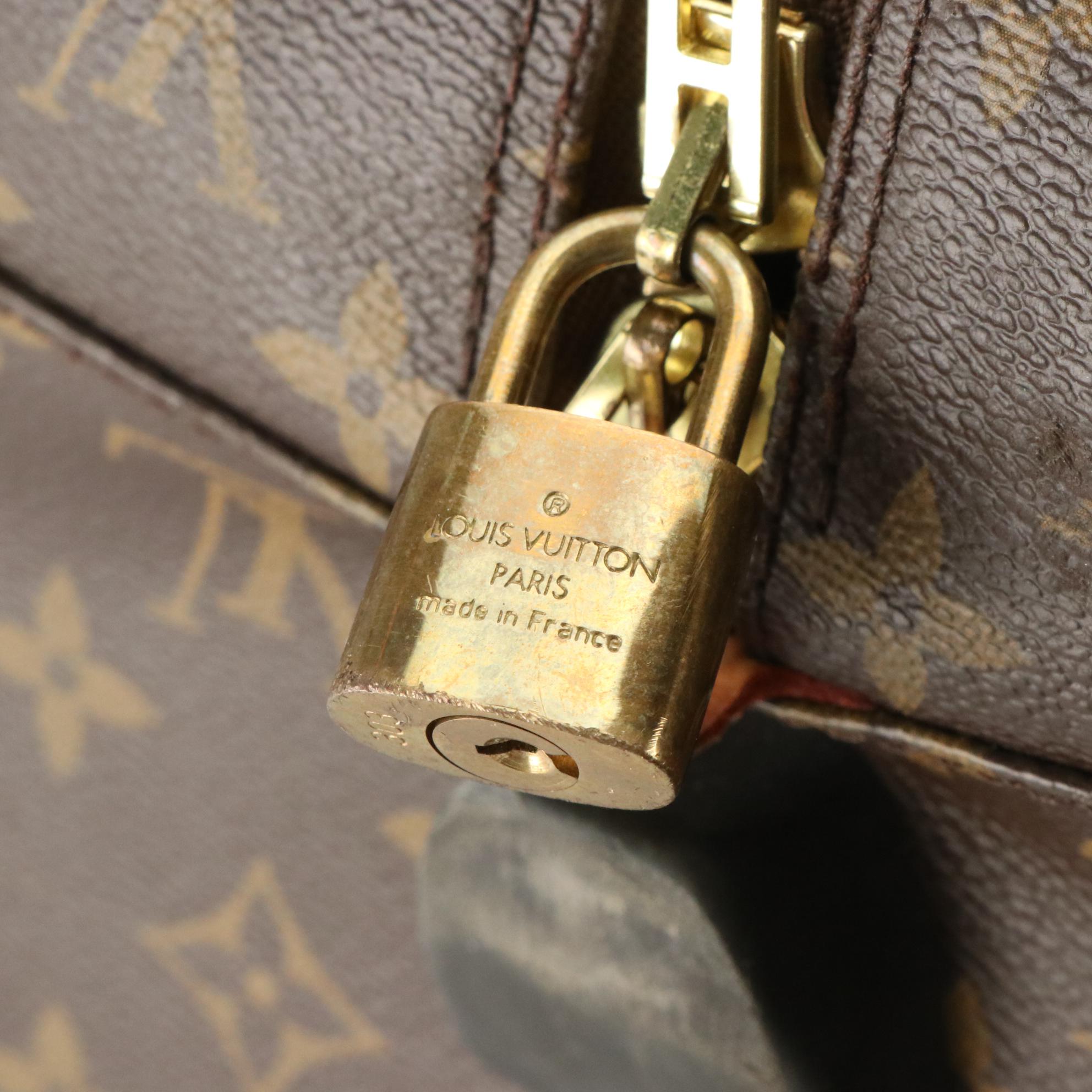 Louis Vuitton Eole 60 Rolling Duffle Bag in Monogram Canvas and Vachetta Leather