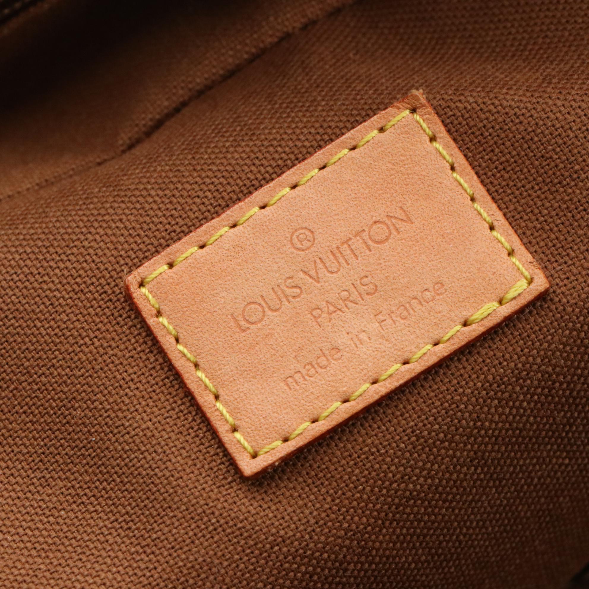 Louis Vuitton Eole 60 Rolling Duffle Bag in Monogram Canvas and Vachetta Leather