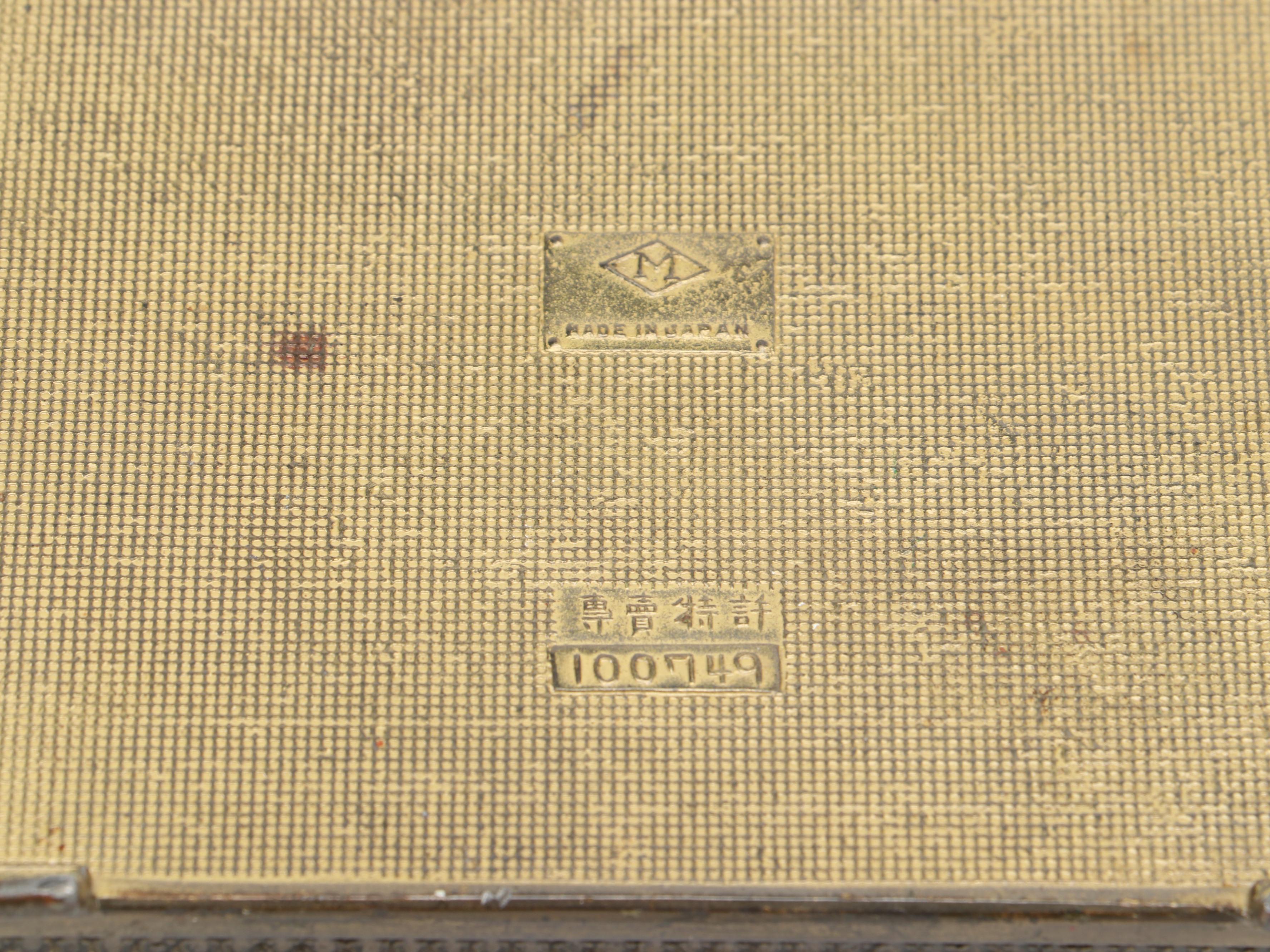 Japanese Metal Cigarette Dispenser Box with Children's Shoes and Plastic Fan