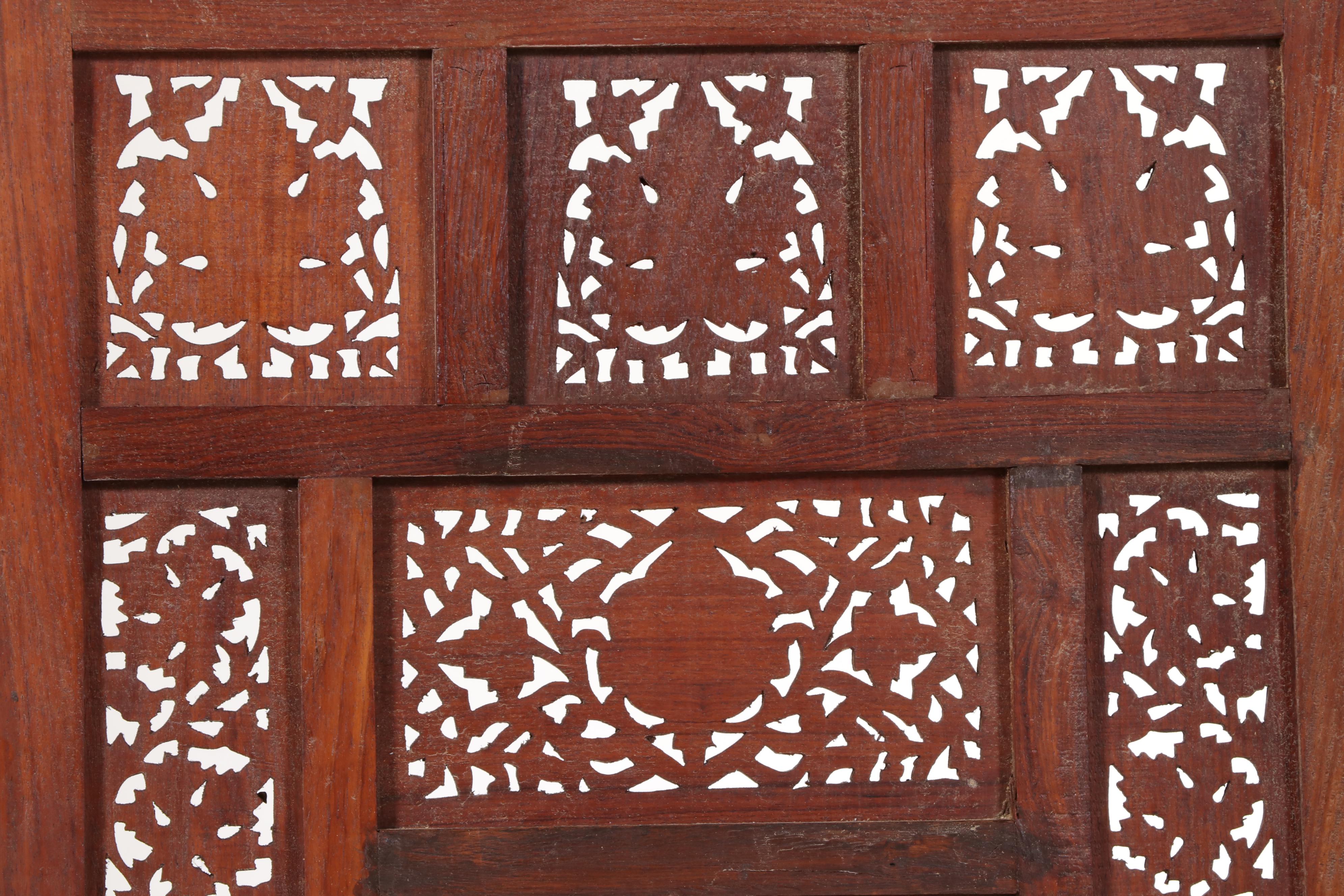 Pair of Indian Carved and Reticulated Teak Two-Panel Folding Screens