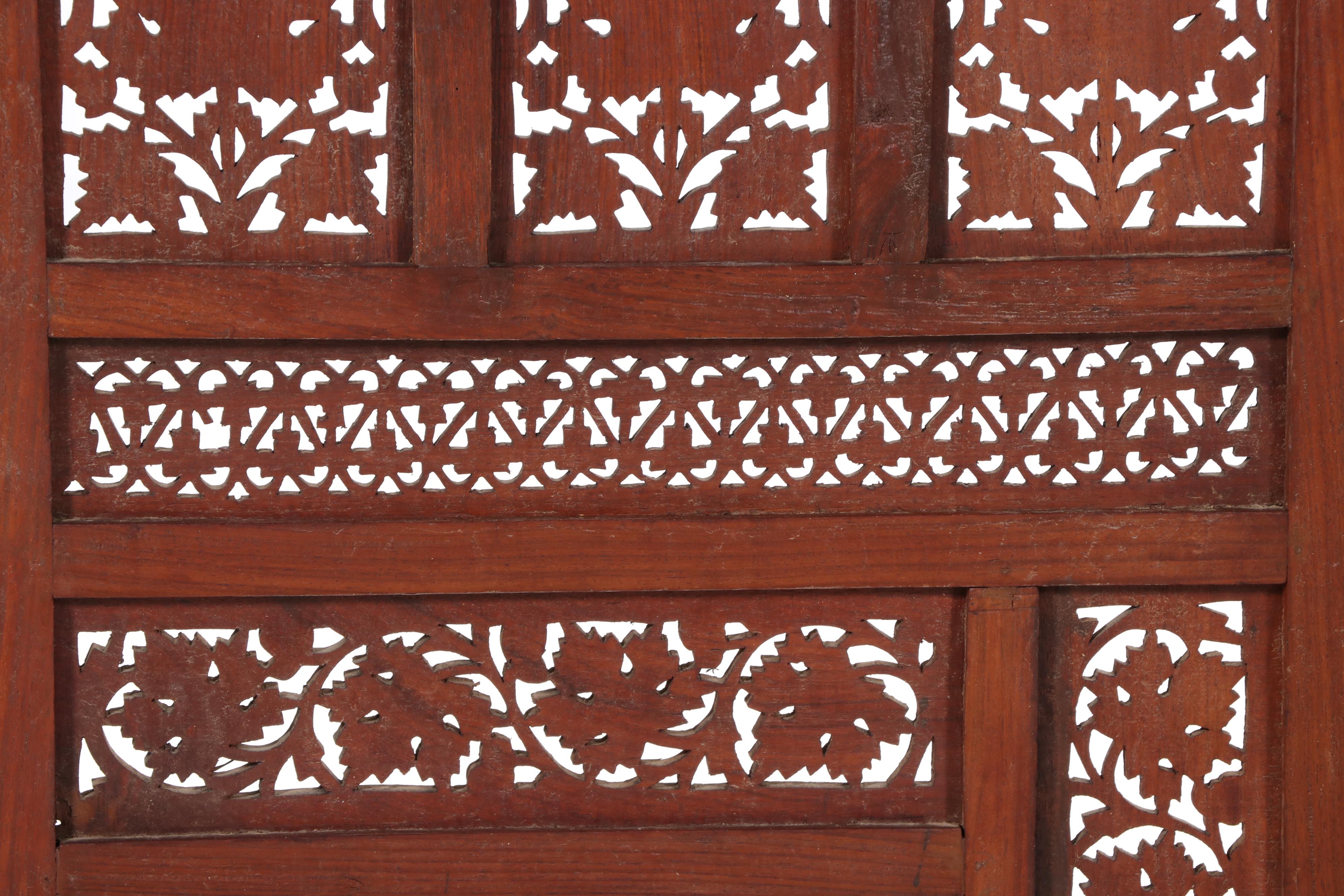 Pair of Indian Carved and Reticulated Teak Two-Panel Folding Screens