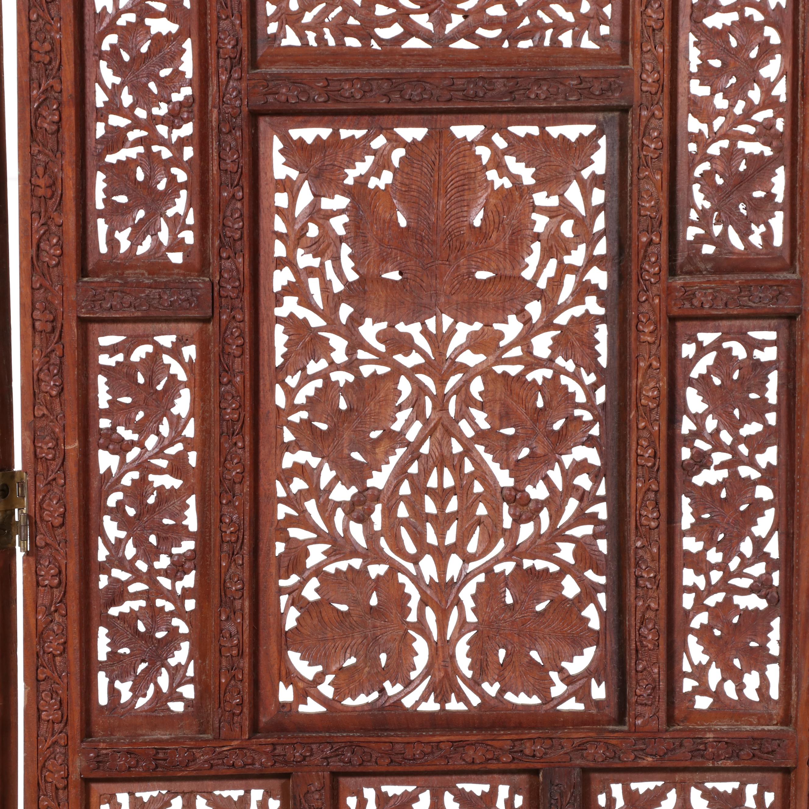 Pair of Indian Carved and Reticulated Teak Two-Panel Folding Screens