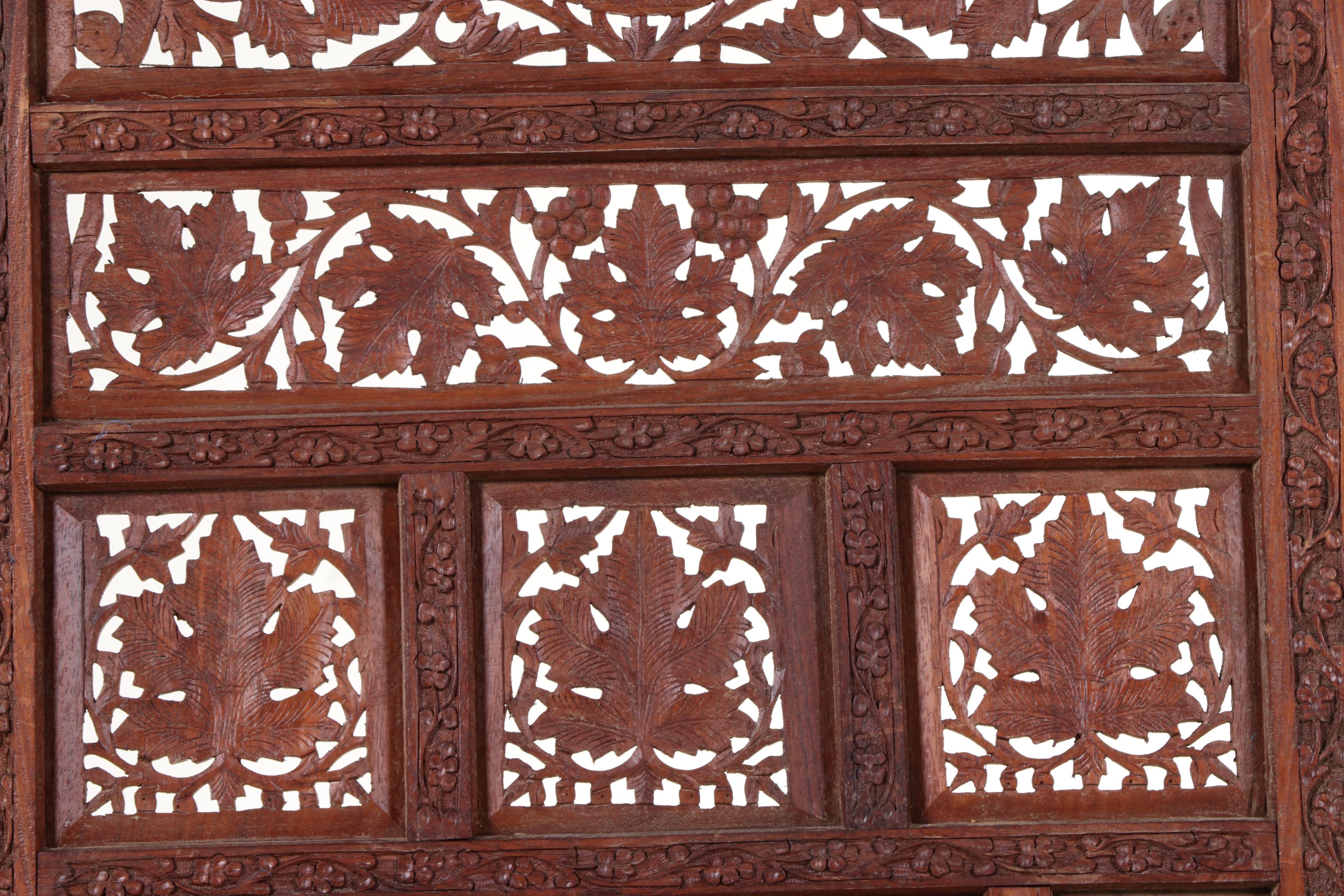 Pair of Indian Carved and Reticulated Teak Two-Panel Folding Screens