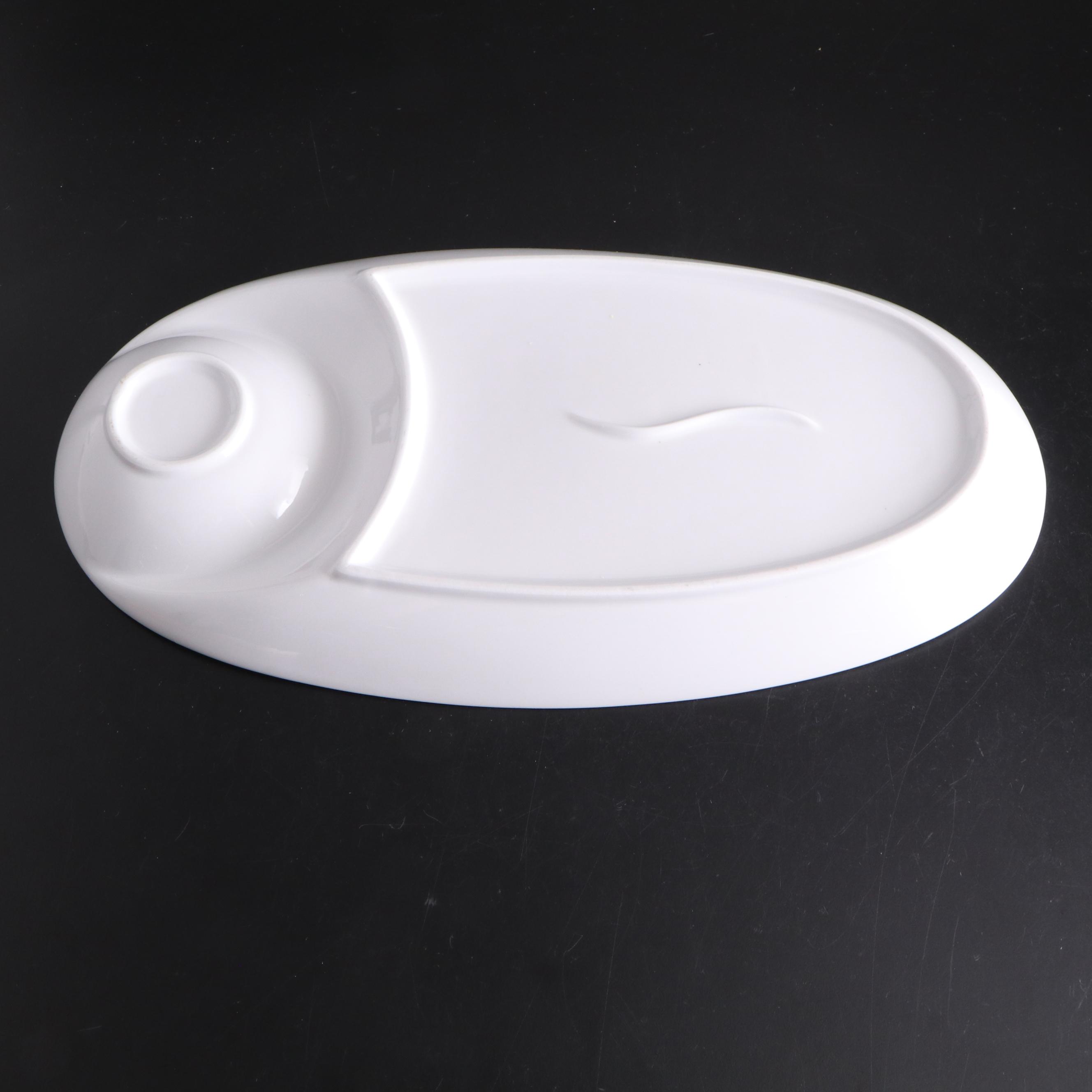 White Ceramic Serveware, Wood and Stone Cutting Board, and Metal Utensils