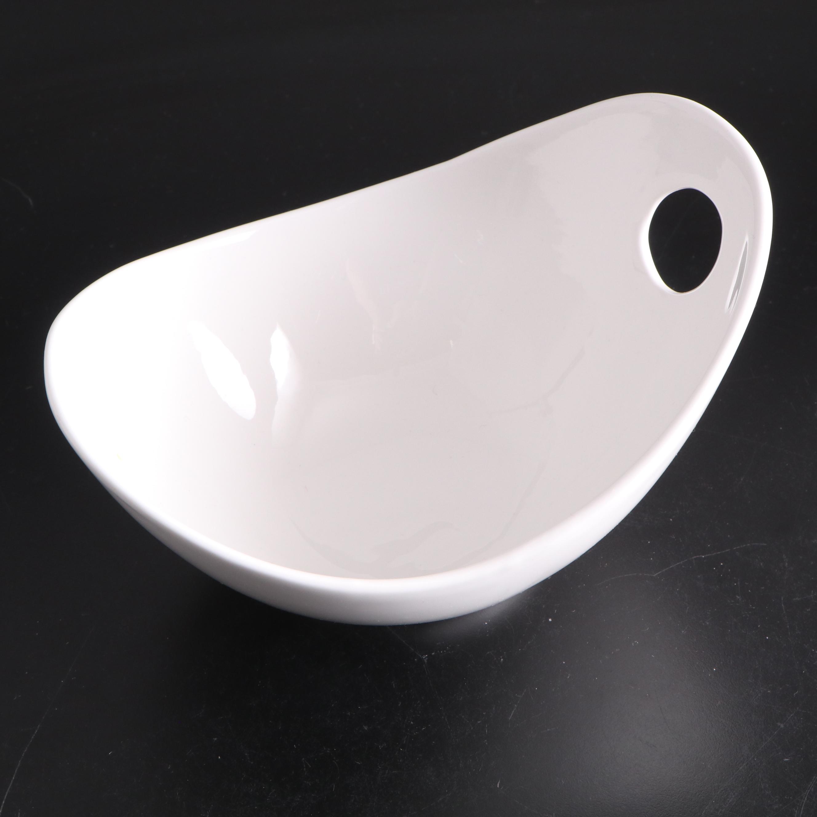 White Ceramic Serveware, Wood and Stone Cutting Board, and Metal Utensils