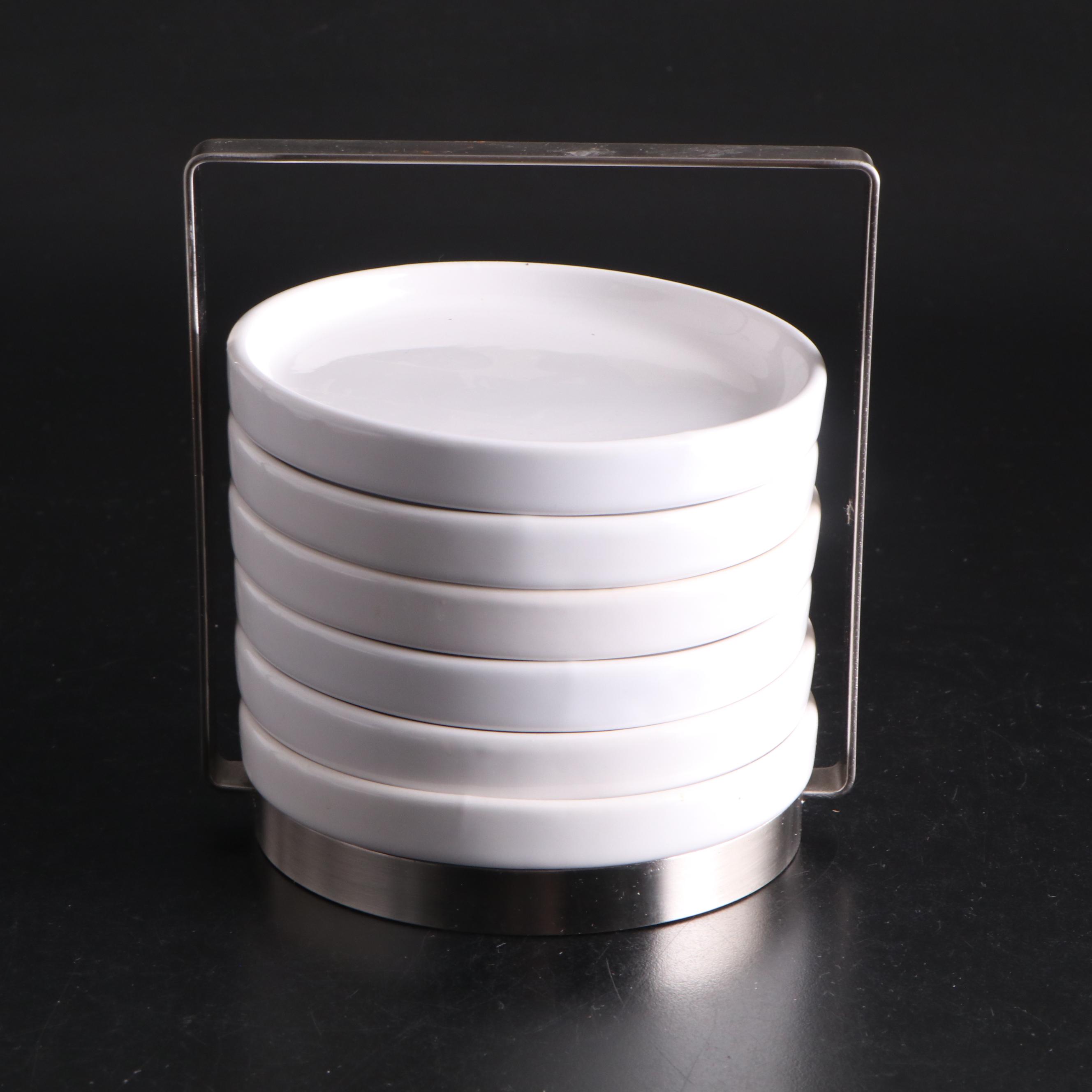 White Ceramic Serveware, Wood and Stone Cutting Board, and Metal Utensils