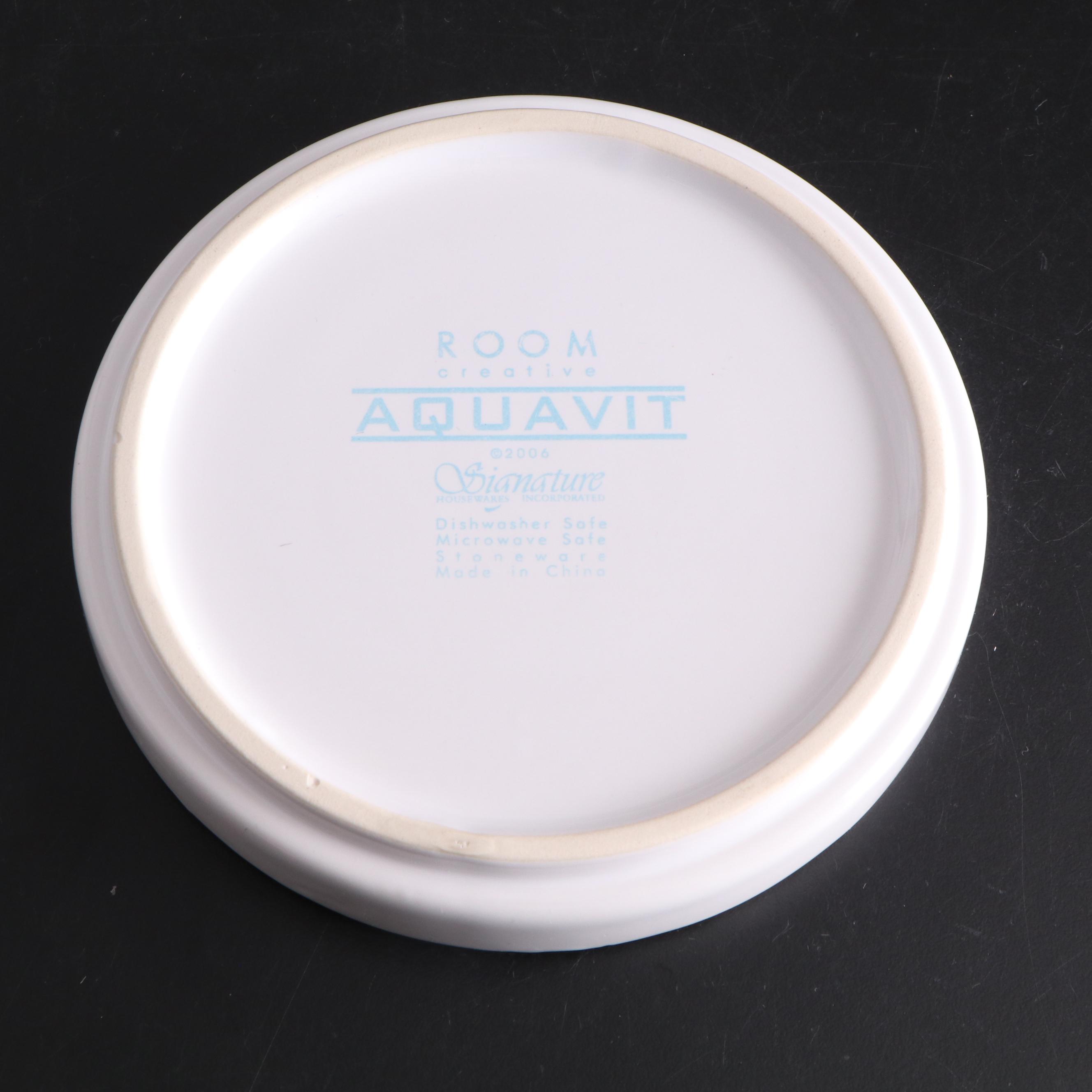 White Ceramic Serveware, Wood and Stone Cutting Board, and Metal Utensils