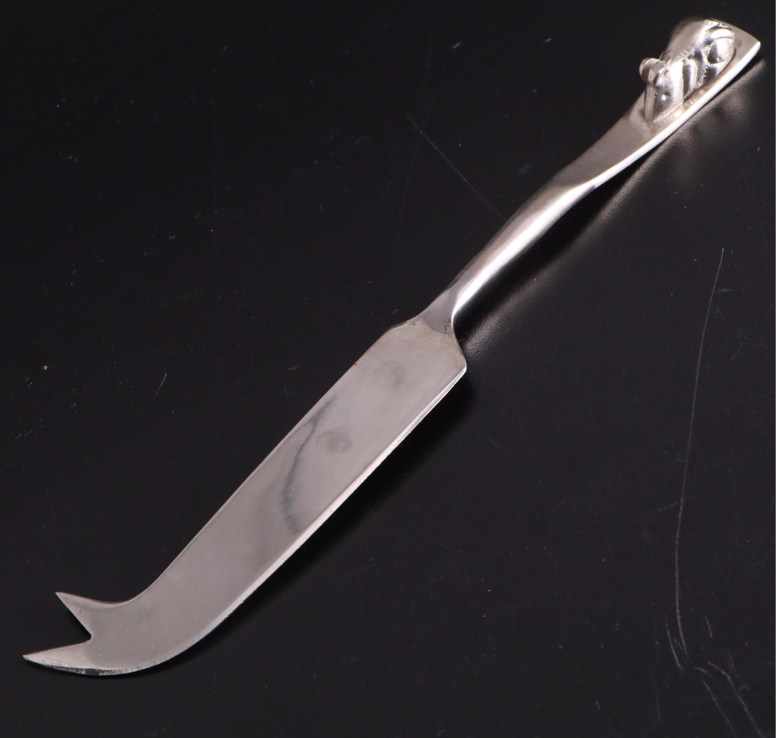 White Ceramic Serveware, Wood and Stone Cutting Board, and Metal Utensils