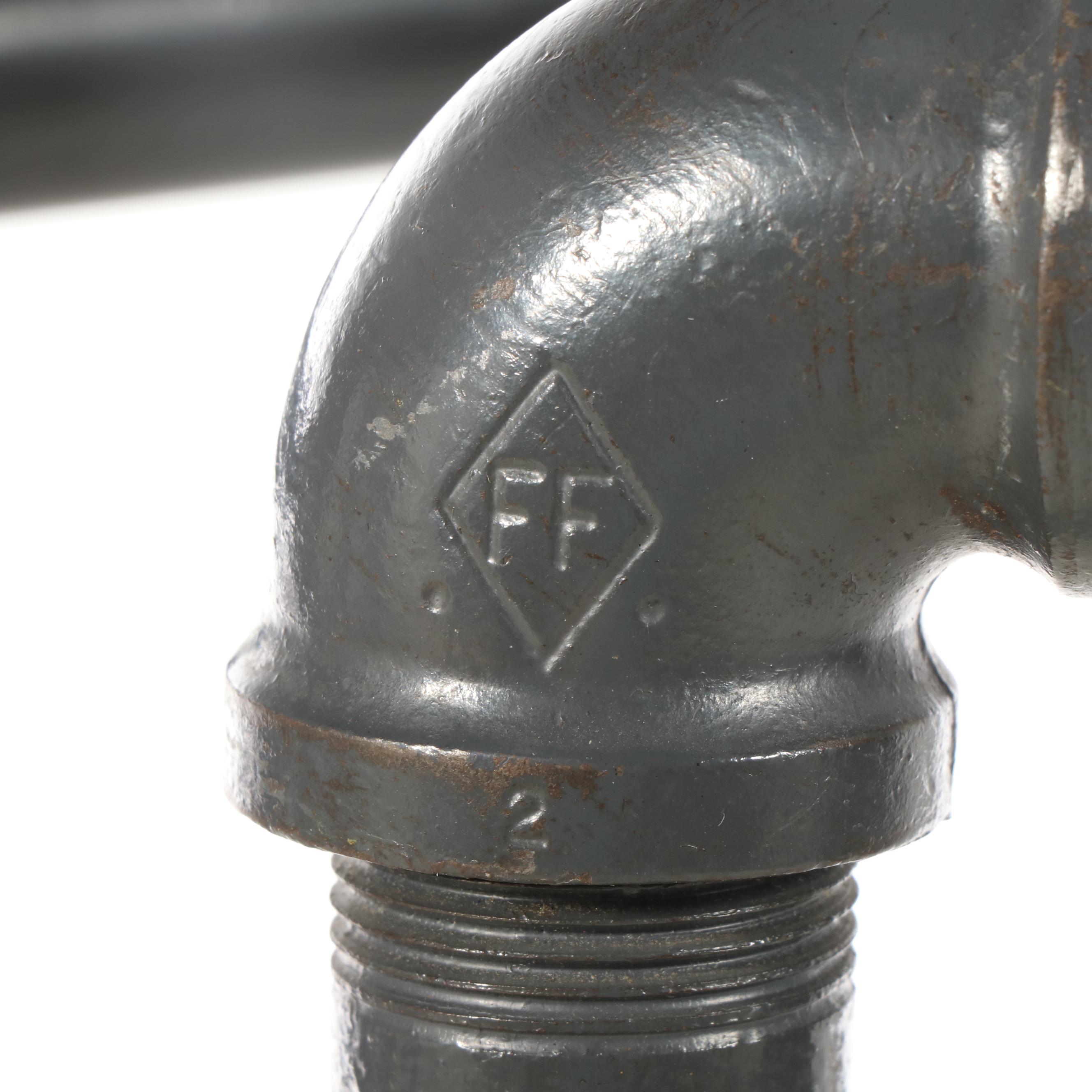 Three Black Iron Pipe Clothes Racks on Wheels