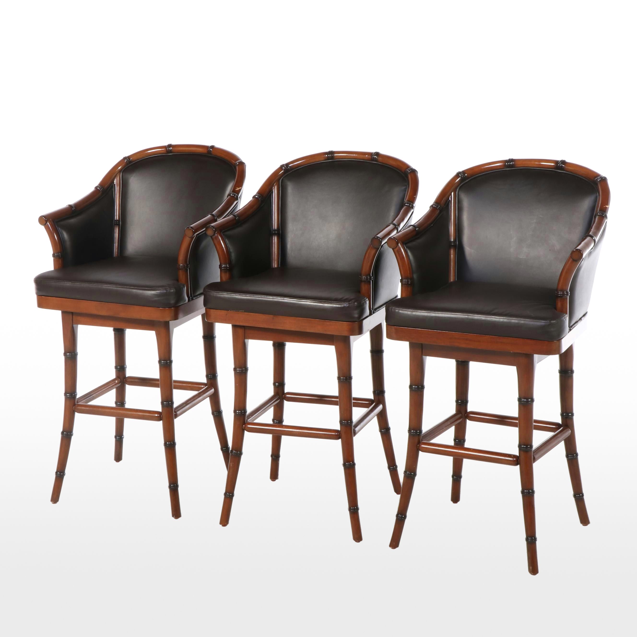 Three Frontgate Faux-Bamboo and Leather Swivel Bar Stools